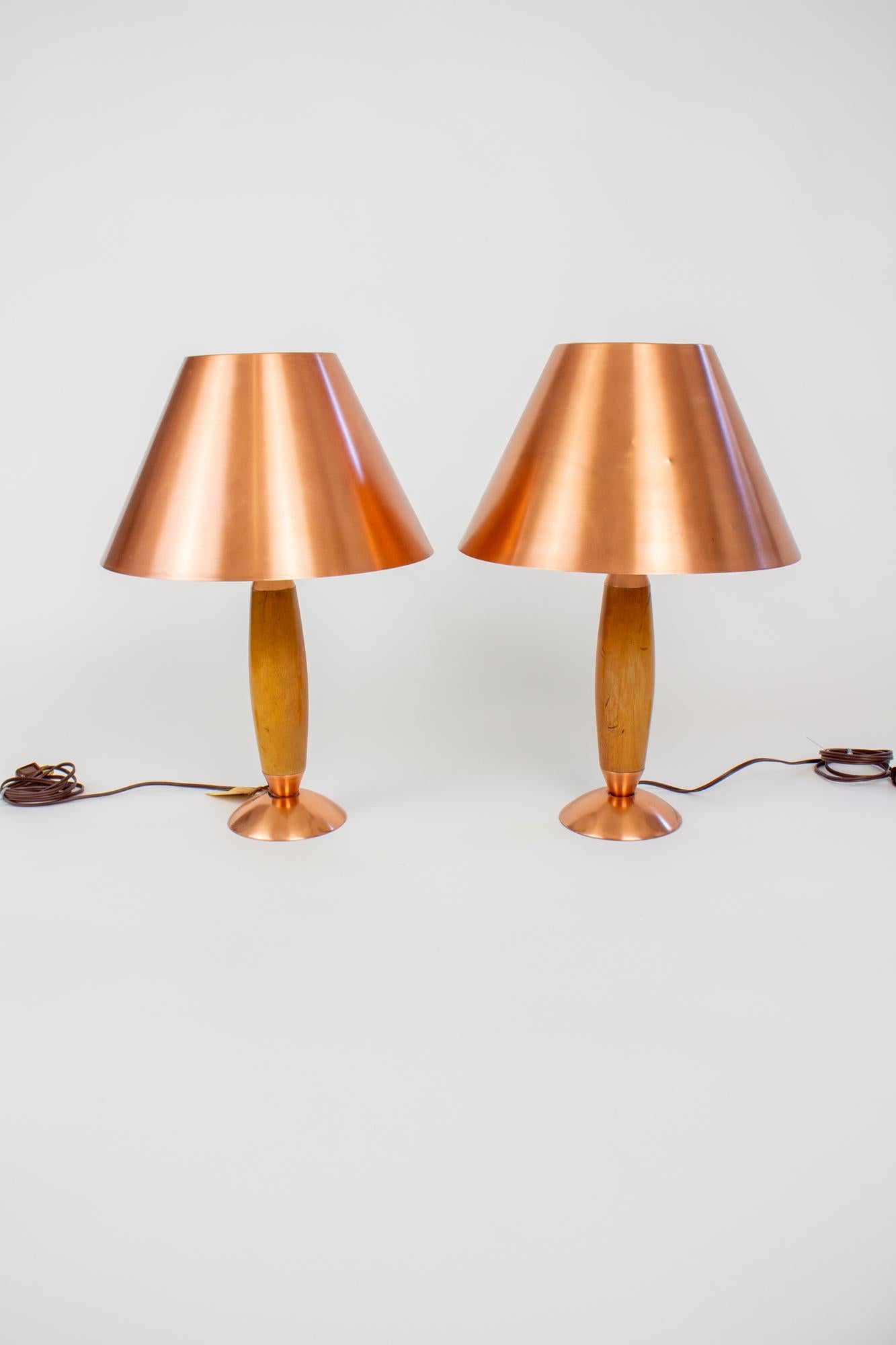 New Old Stock Lamps. They were hidden for 60 years in storage, and have been hand refinished and rewired. Solid wood and copper with original copper shade. Part of the 