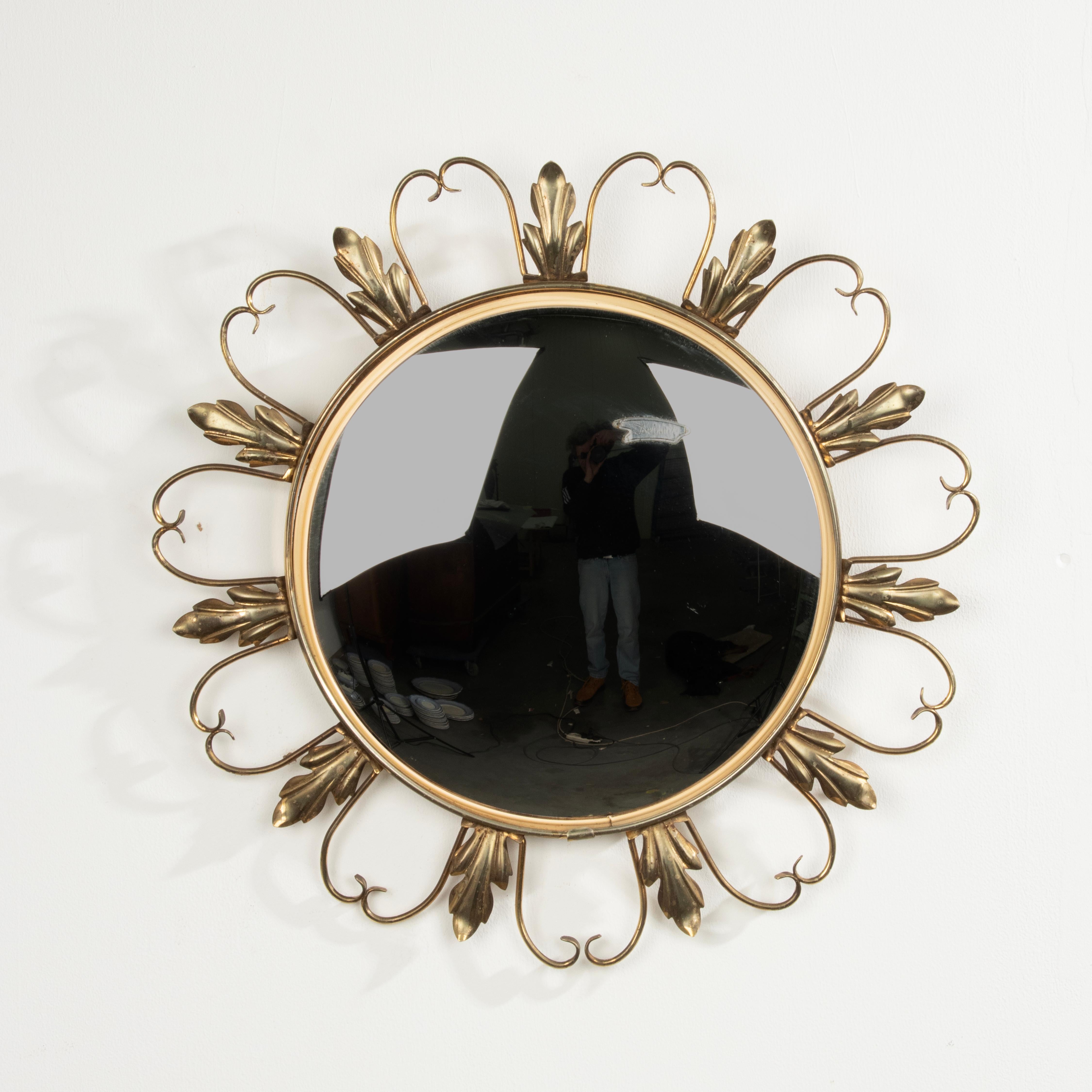 An elegant convex wall mirror, also called 