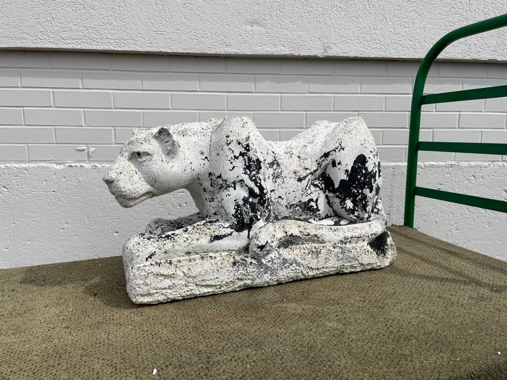 Mid-20th Century plaster crouching panther that was likely a table base, now a very cool piece of sculpture. The weathered surface and intense gaze give this a wonderful presence. You can feel this guy looking at you! With traces of original black