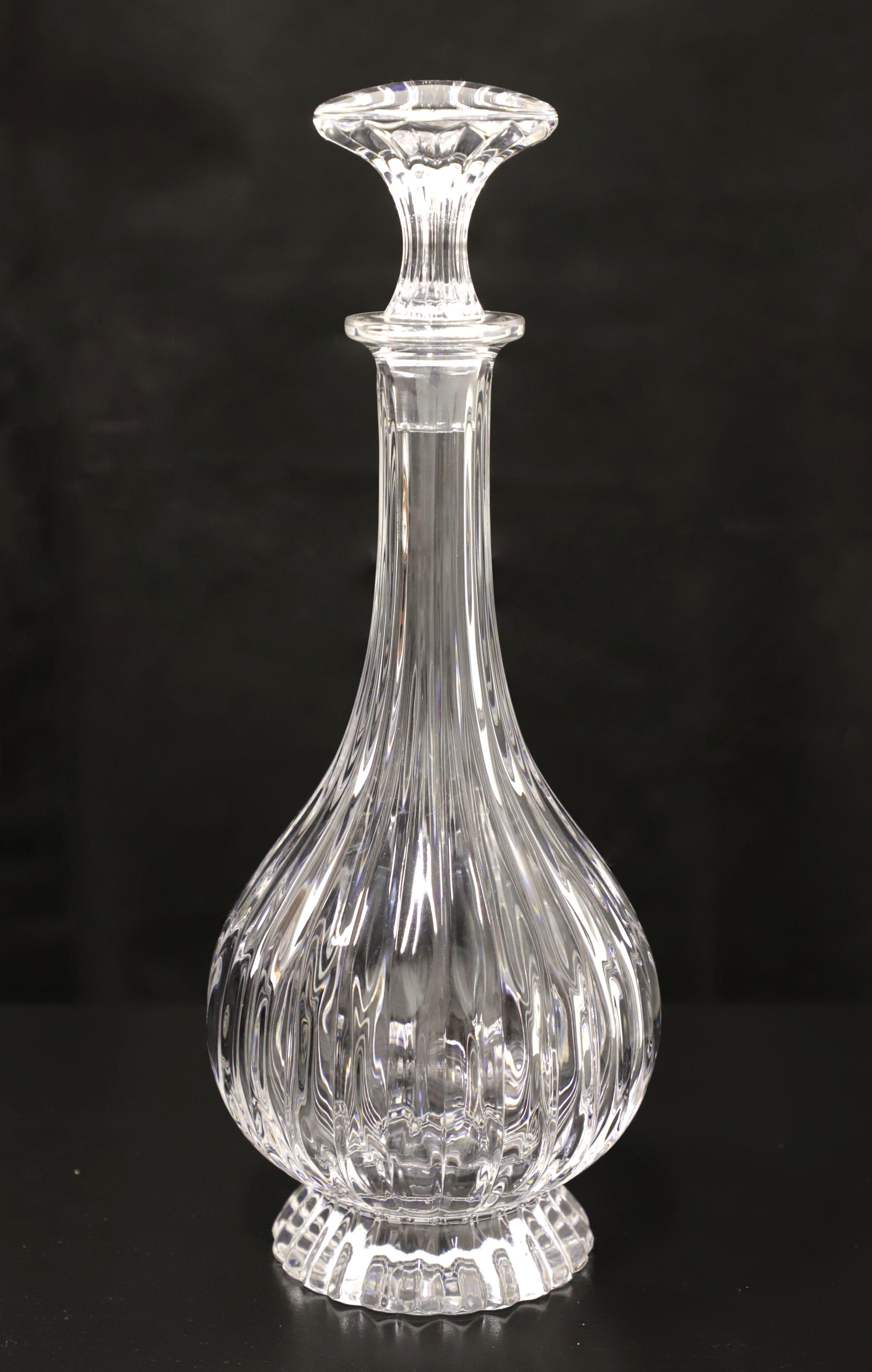 A Mid 20th Century crystal decanter. Clear crystal decanter with swirl pattern. Clear crystal swirl pattern stopper. Origin unknown, most likely the USA.

Measures: 5 W 5 D 13 H, Weighs Approximately: 3 lbs

Exceptionally good condition. No chips,