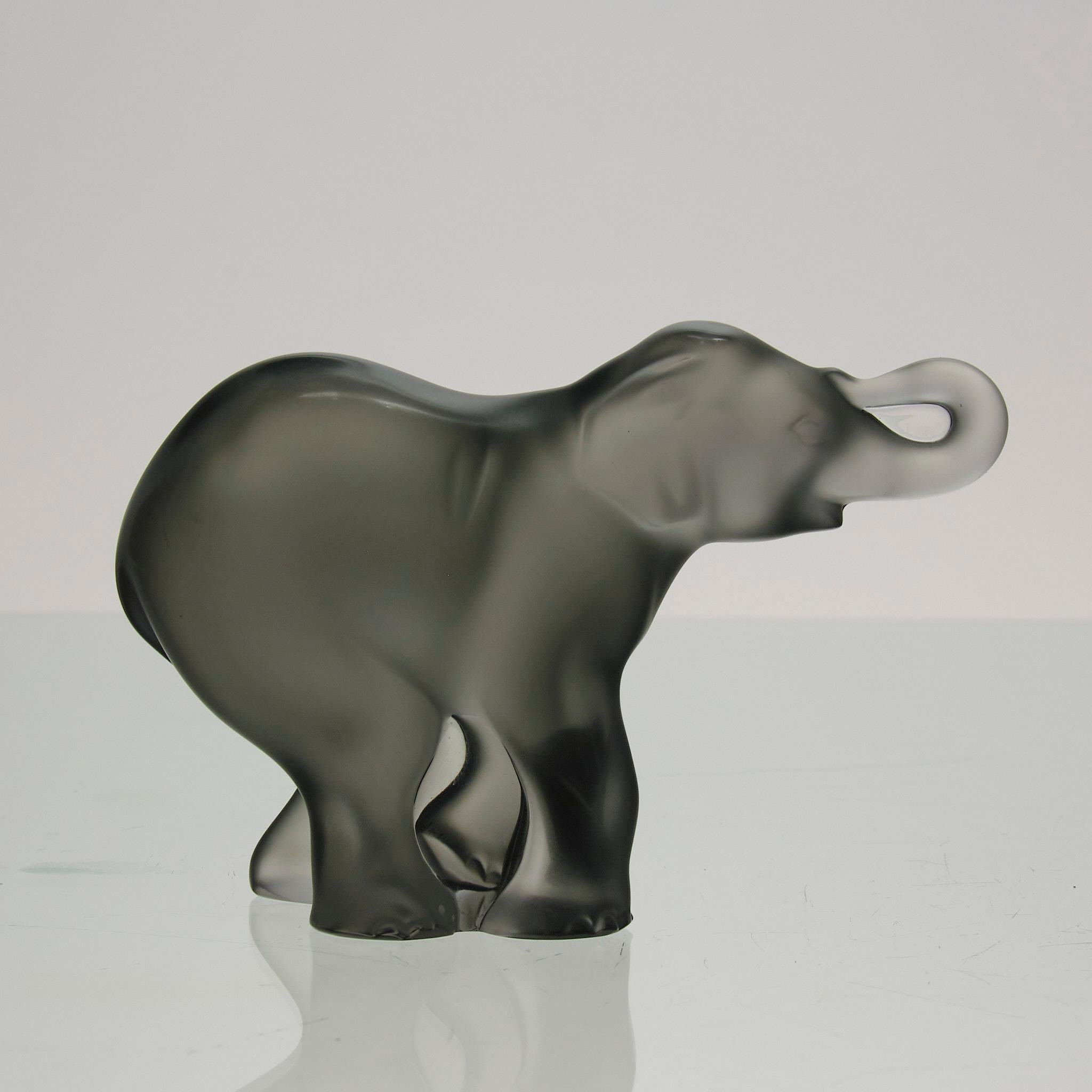 An endearing mid 20th Century frosted grey glass study of a charming young elephant with excellent colour and fine tactile surface detail, signed Lalique France 

ADDITIONAL INFORMATION
Height:                                   8 cm

Condition:     