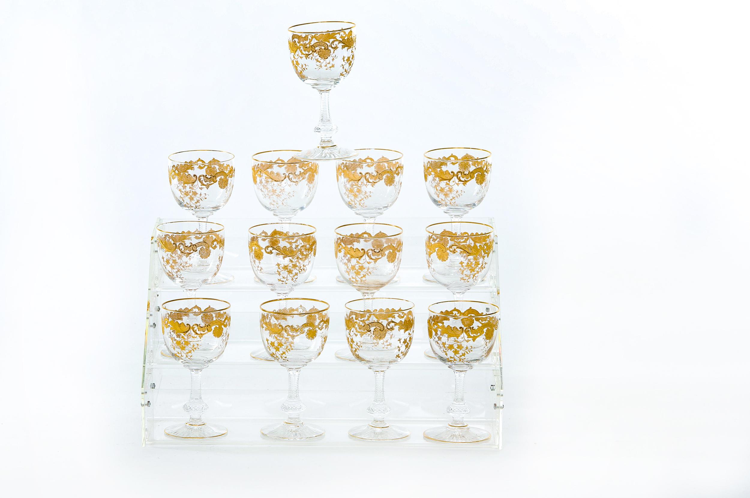 Mid-20th century Saint Louis crystal with gold design details tableware / barware wine / water service for twelve people. Each one is in great condition. Maker's mark stamped undersigned. Each one stands about 6.5 inches tall x 3 inches diameter.