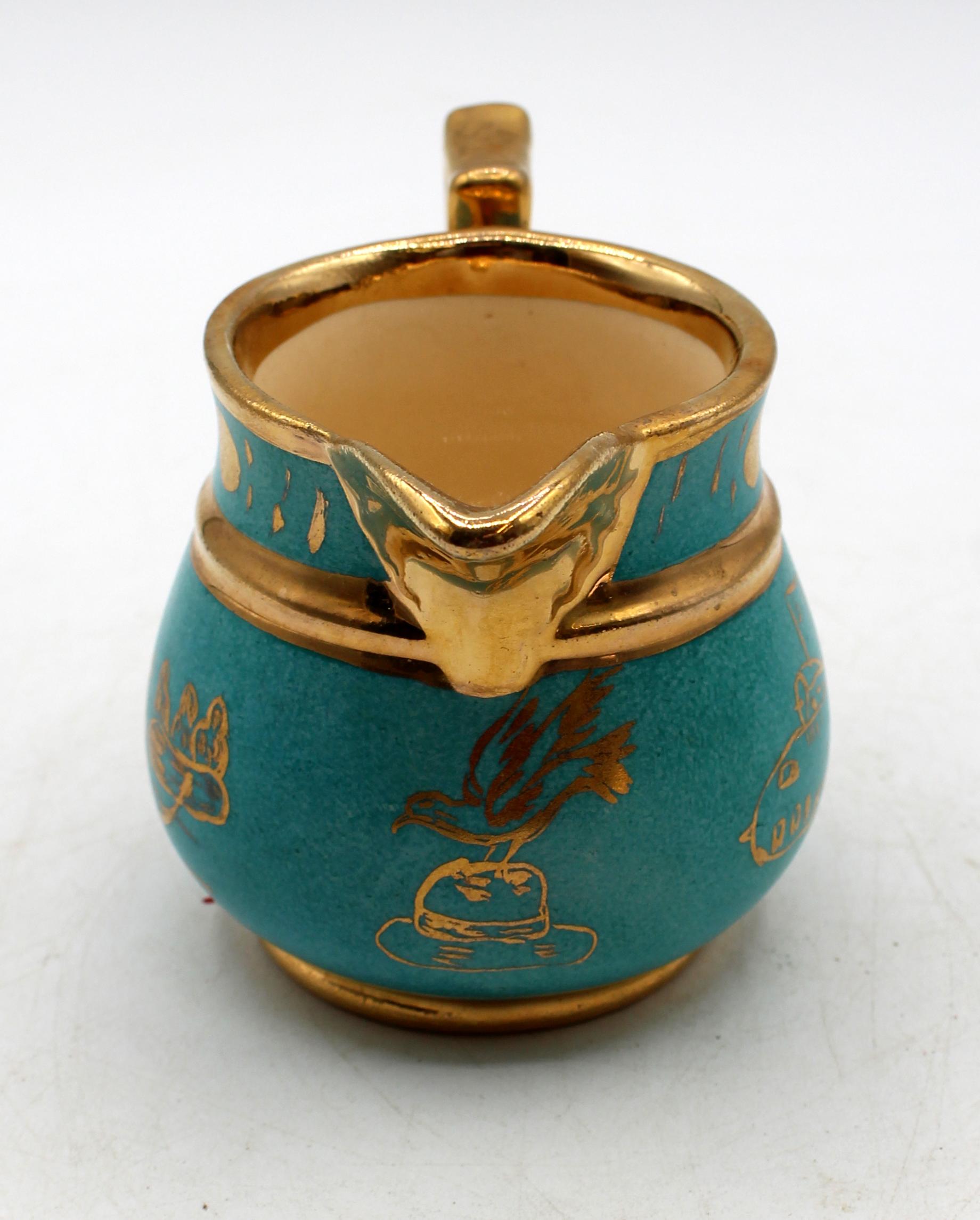 Mid-20th century Cumbow pottery pitcher, Abbington, VA. A rare example, this pitcher was made to commemorate the 1942 survival of Captain Eddie Rickenbacker on his secret mission with a letter from Eisenhower to MacArthur. It shows the plane,
