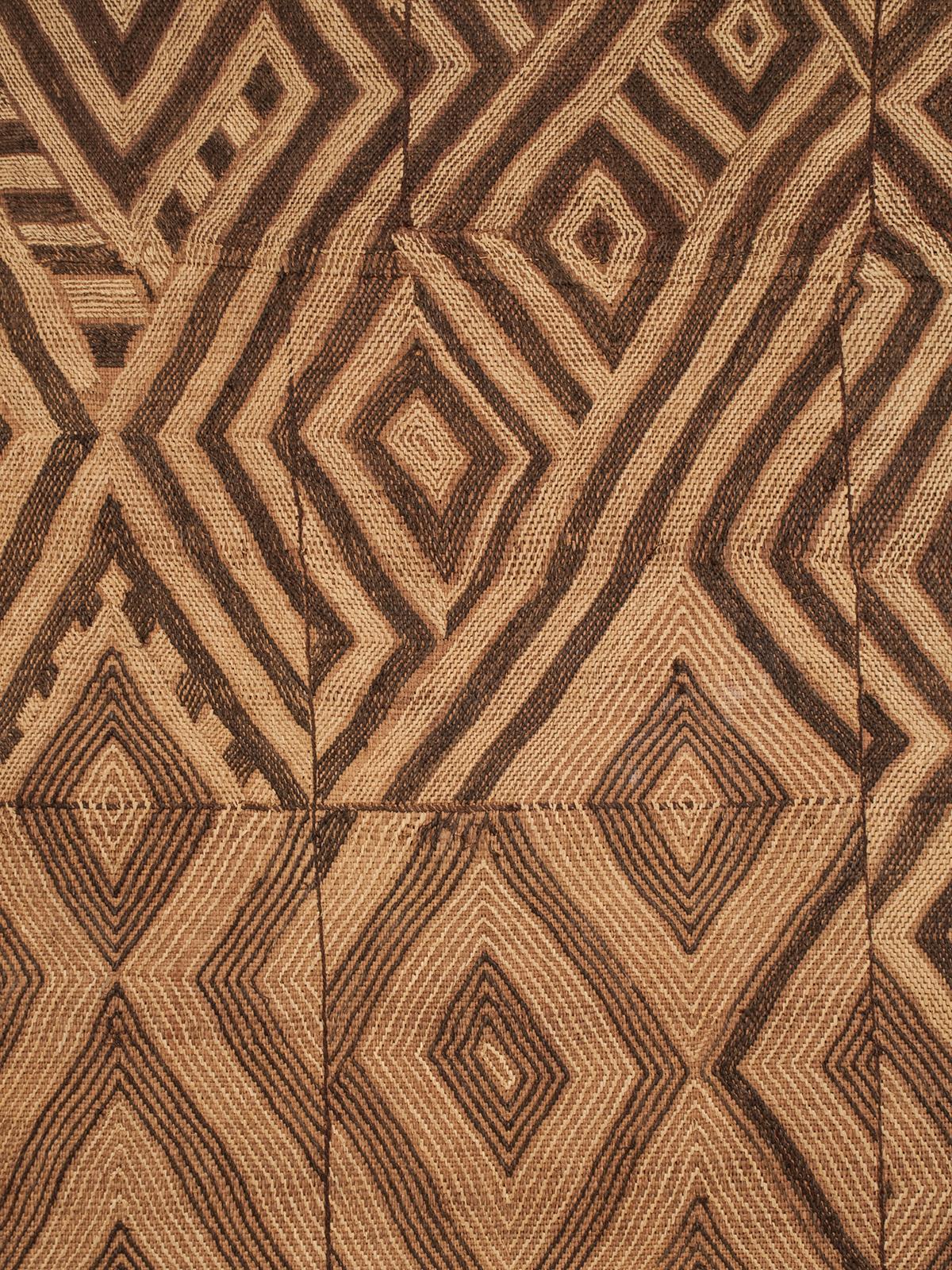 Mid-20th century dance skirt panel, Kuba, D.R.Congo

A visually stunning jazzy embroidered raffia skirt panel from the Kuba people of DR Congo with diamond shapes that morph into zig-zags, lines and X patterns.
The panel is professionally mounted on