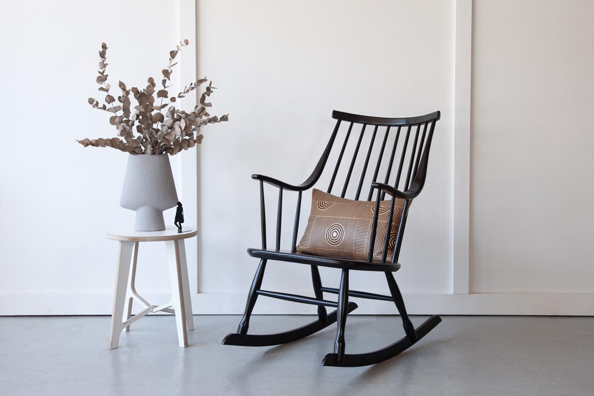 The iconic Grandessa rocking chair, designed by Lena Larsson in 1961 for Nesto. Made from black lacquered beechwood, its refined lines and beautiful curves make this rocker a much sought after piece and a wonderful addition to any living room