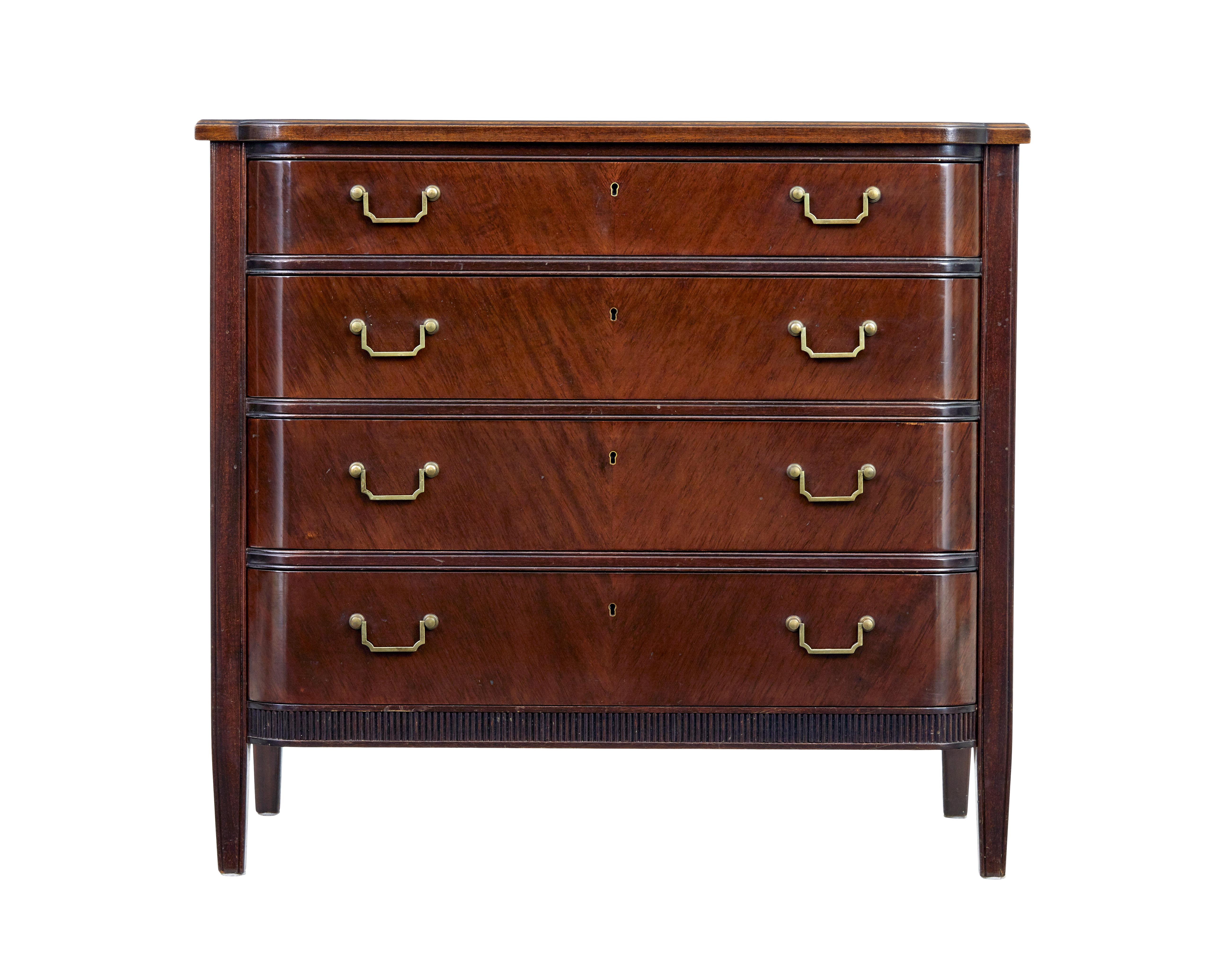 Fine quality Scandinavian mahogany chest of drawers circa 1950.

Good quality piece of furniture fitted with 4 graduating drawers.  All fitted with shaped brass handles.

Fluted detail along the bottom edge contrasting with the smoothness of the