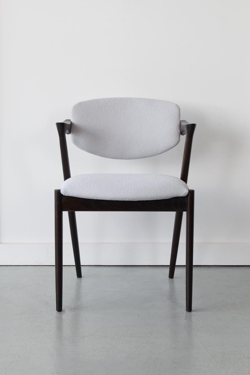 Original Kai Kristiansen Model 42 dining chair produced by Schou Andersen. This iconic model is the most desired of all the chairs designed by this admired Danish designer, Kai Kristiansen. These chairs are very comfortable and supportive with the