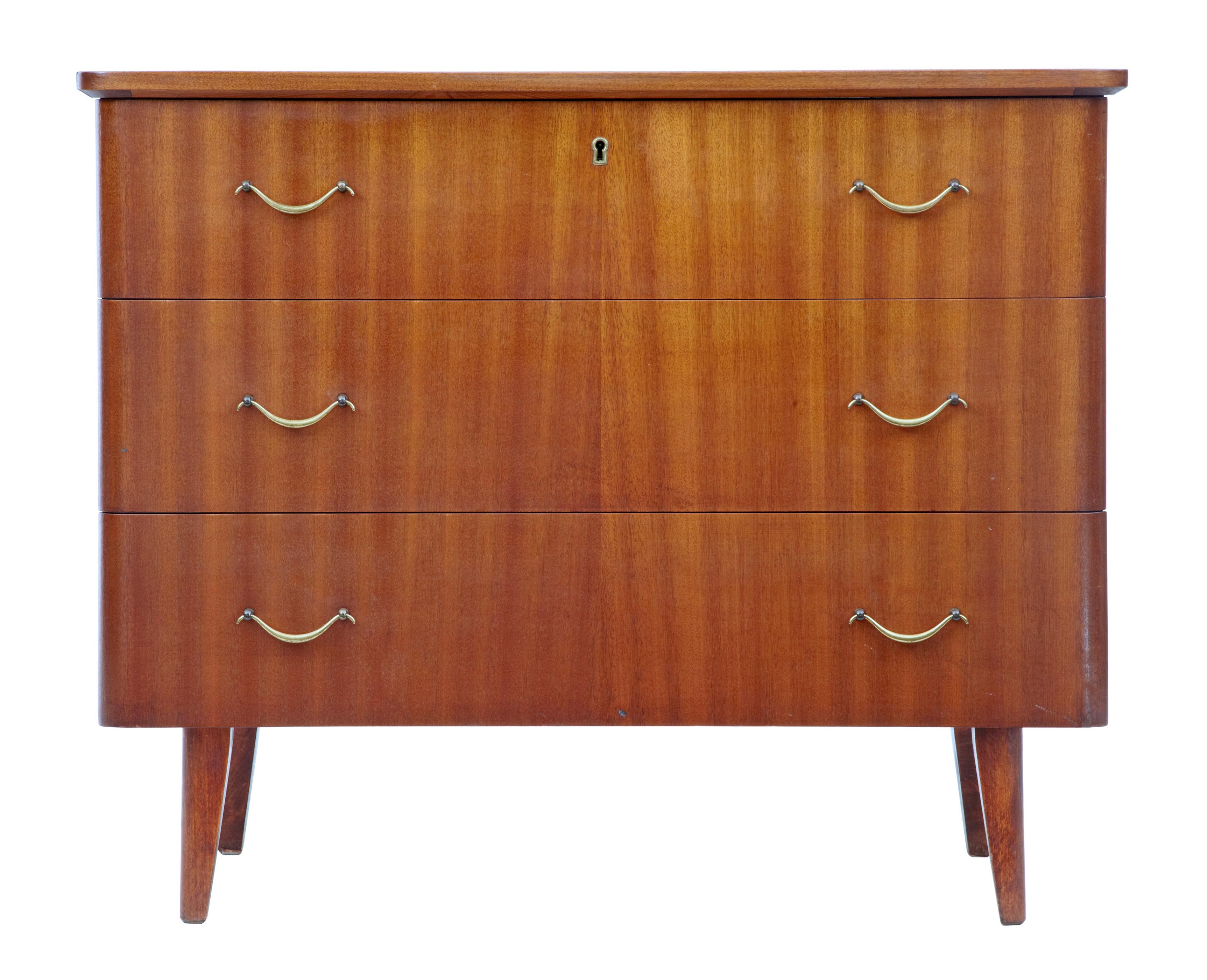 Mid-20th century Danish teak chest of drawers, circa 1960.

3 drawer scandinavian design chest of drawers from the 1960s. Veneered in teak and fitted with brass handles and escutheons.

Good rich color. Some light marks in line with use.