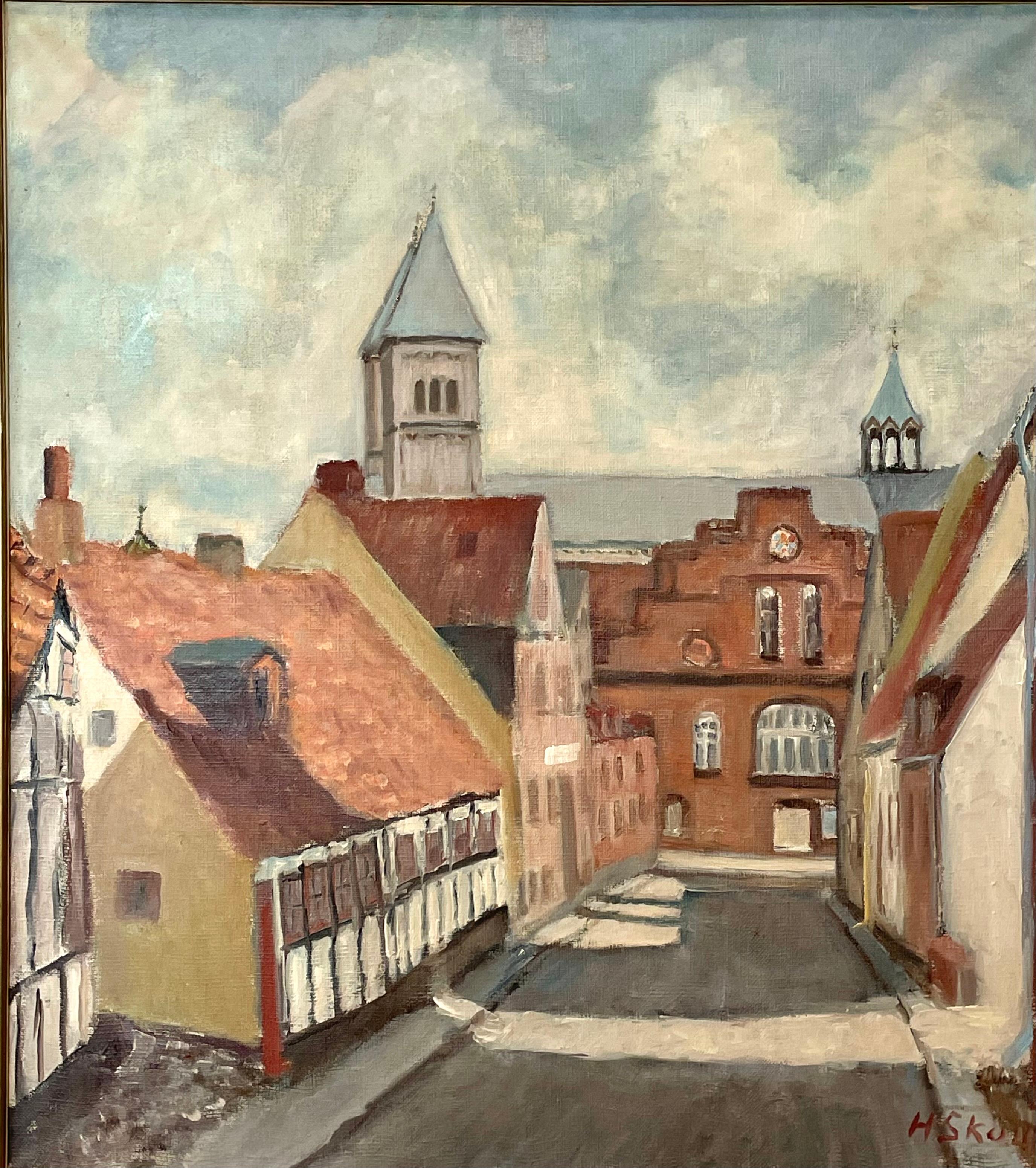 Es handelt sich um ein exklusives Originalgemälde in Öl auf Leinwand von Hans Skou, das auf die Mitte des Jahrhunderts zurückgeht.
Es ist in einen weiß gestrichenen Holzrahmen eingefasst und zeigt ein Stadtmotiv mit schönen alten Häusern und einer