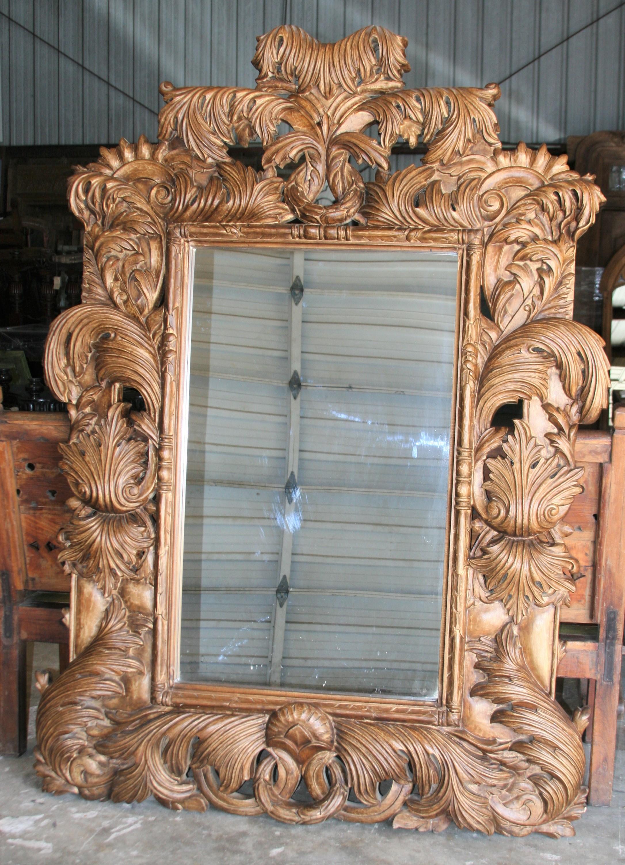 An exceptional custom hand carved mirror in hard Sheesham wood. This mirror is large and heavy. Inimitable carving and finish. It would be difficult to find another one like this in the market. See the close ups of the details to appreciate the work