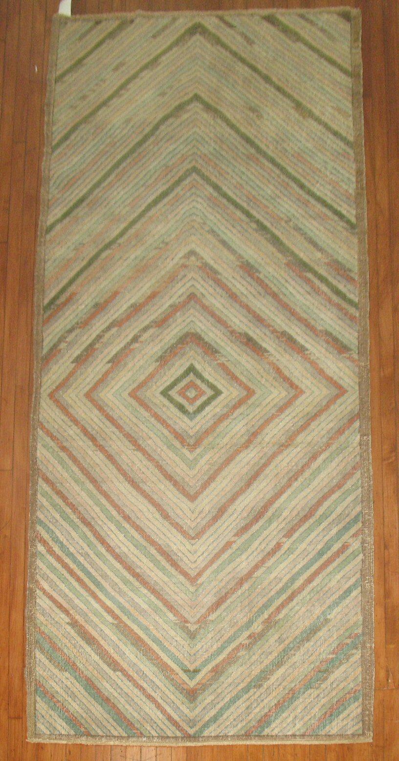 A one of a kind midcentury Turkish Deco rug in soft green, apricot, beige, brown and off-white accents.

Size: 4'5