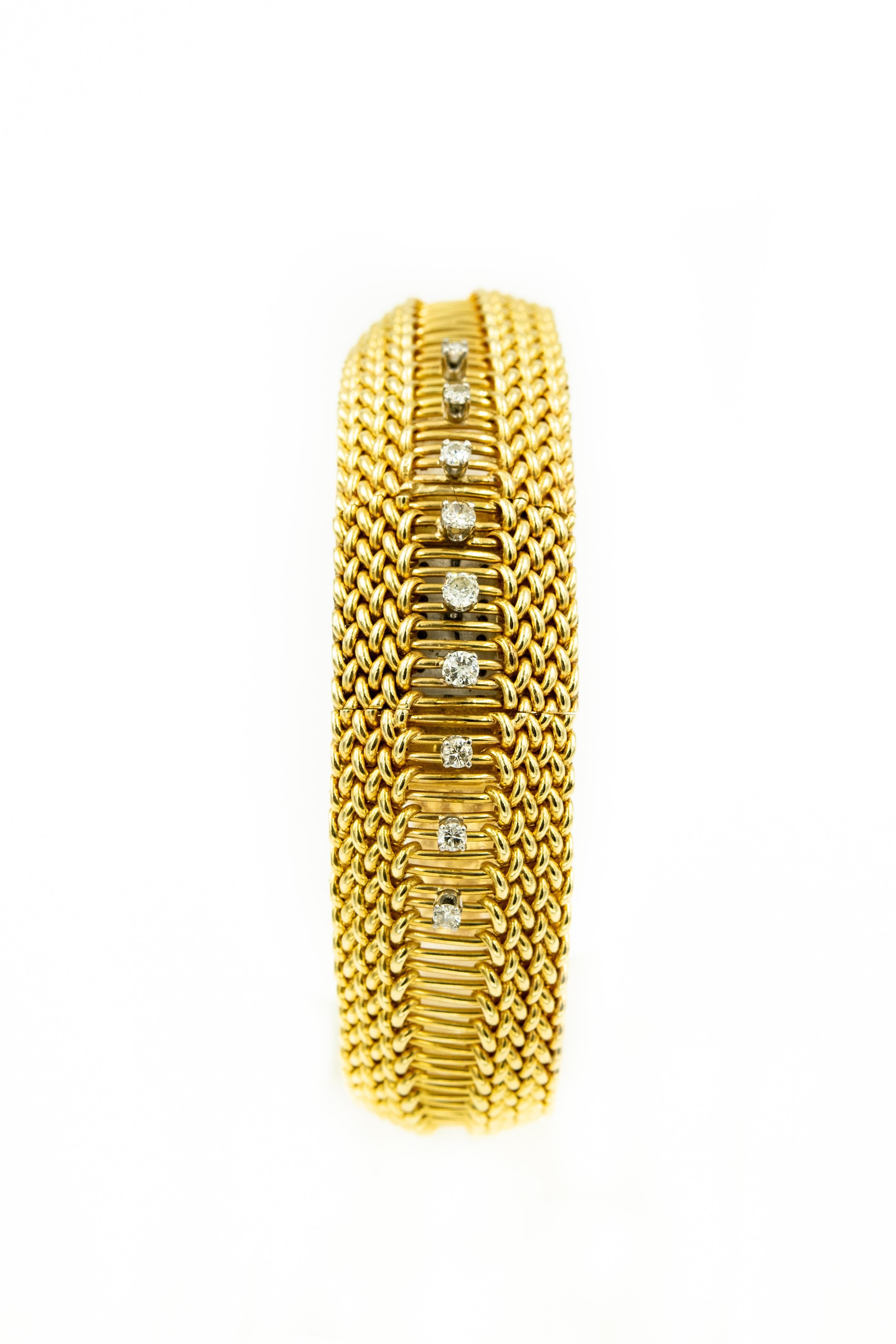 Elegant covered 14k yellow gold woven ladies watch with 9 prong set diamonds going in a line from top to bottom.  The approximate total diamond weight is .36 carats.  The cover hinges from the side and opens to reveal the dial says which says King's