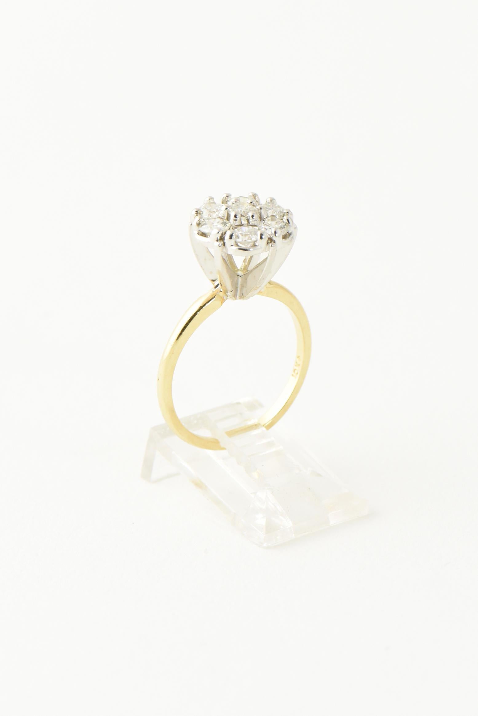 flower ring with diamond in the middle