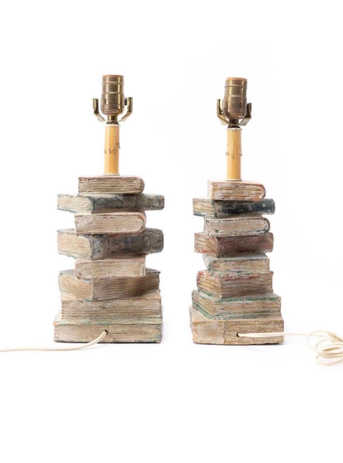 Group of two distressed wooden stacked book lamps, having a polychrome painted finish. Unmarked. Approx. of the wider stack, H 14.5