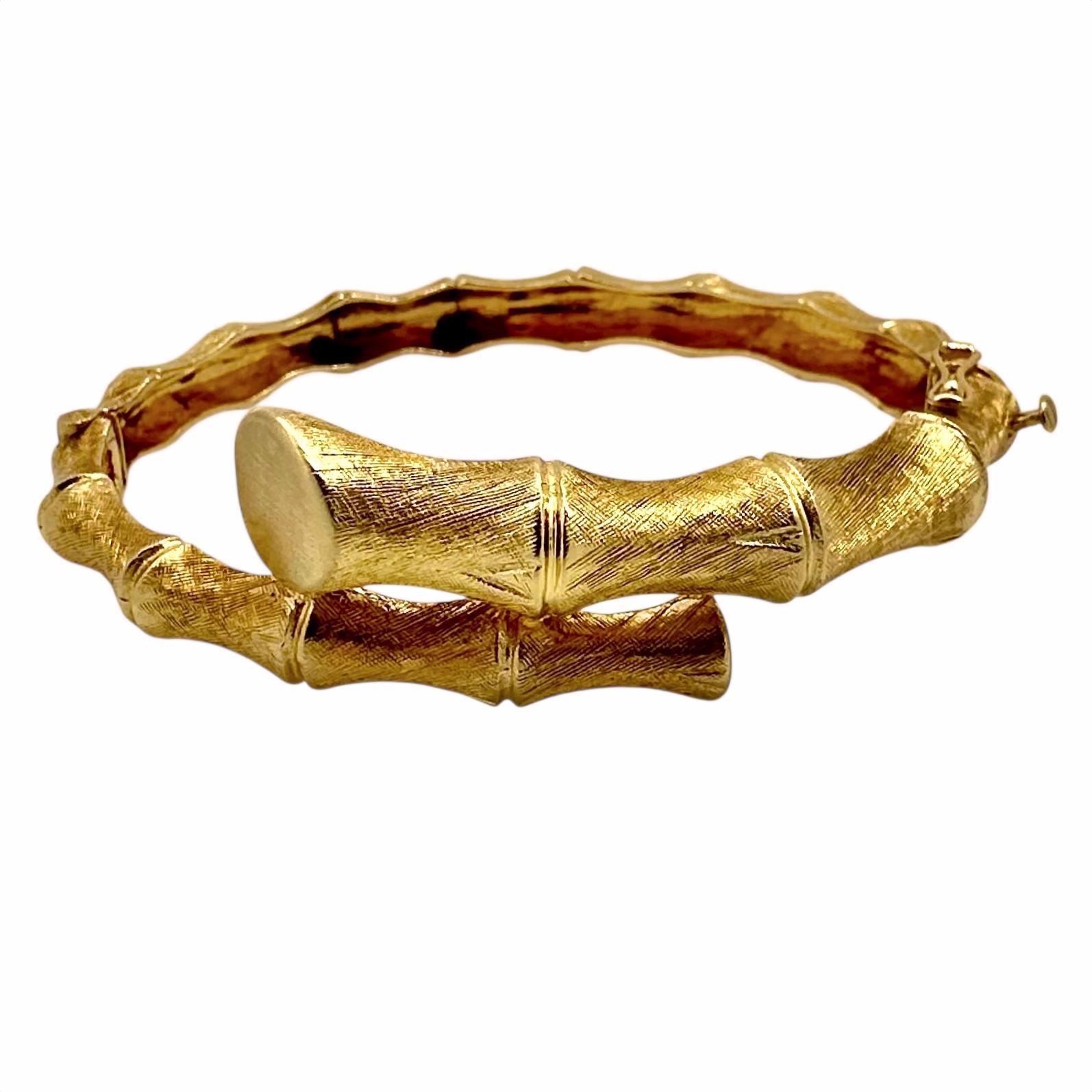 Bamboo motif fine gold jewelry was a much sought after genre in the mid-20th Century. This example is well manufactured and is rich in intricate details. The entire surface is double Florentine finished allowing the bracelet to shimmer and