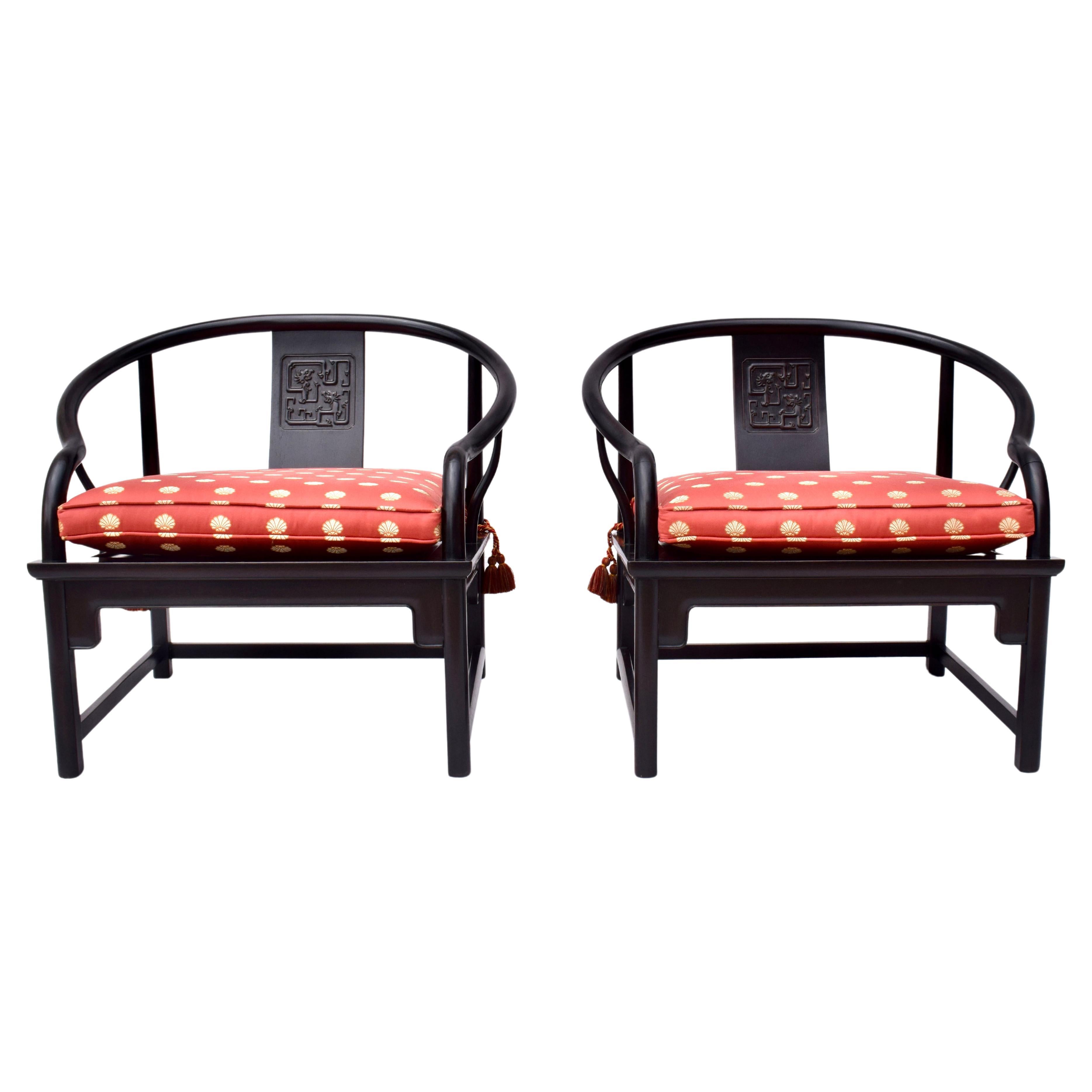 An impressive pair of solid Ebony mid 20th Century Chinoiserie chairs with distinct influences seen in later designs by Michael Taylor for Baker; 1960's. Of heirloom quality possessing a transitional aesthetic, the chairs are suitable for placement