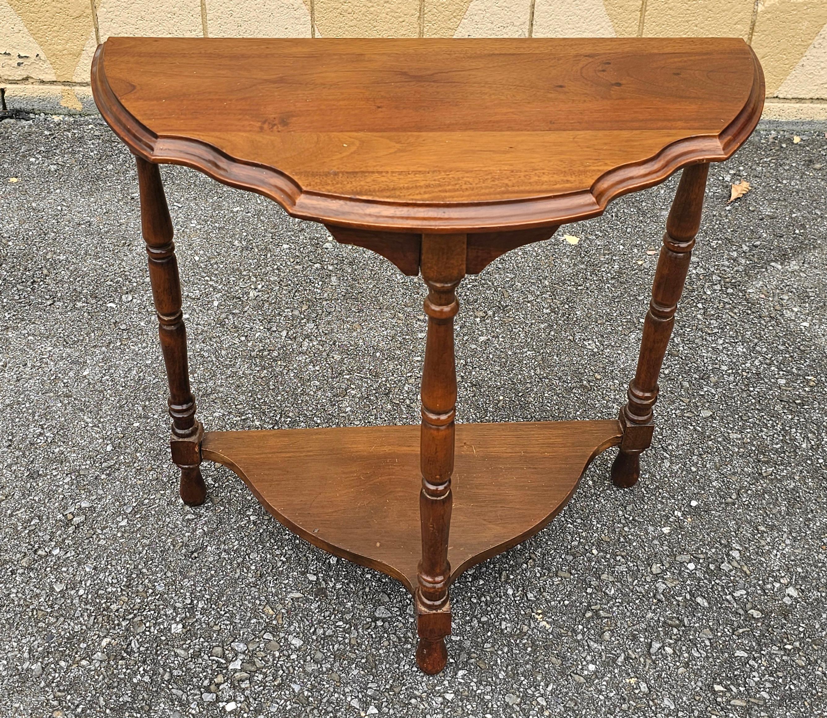 A Mid 20th Century Edwardian Style Tiered Mahogany Console Table
. Measures 24