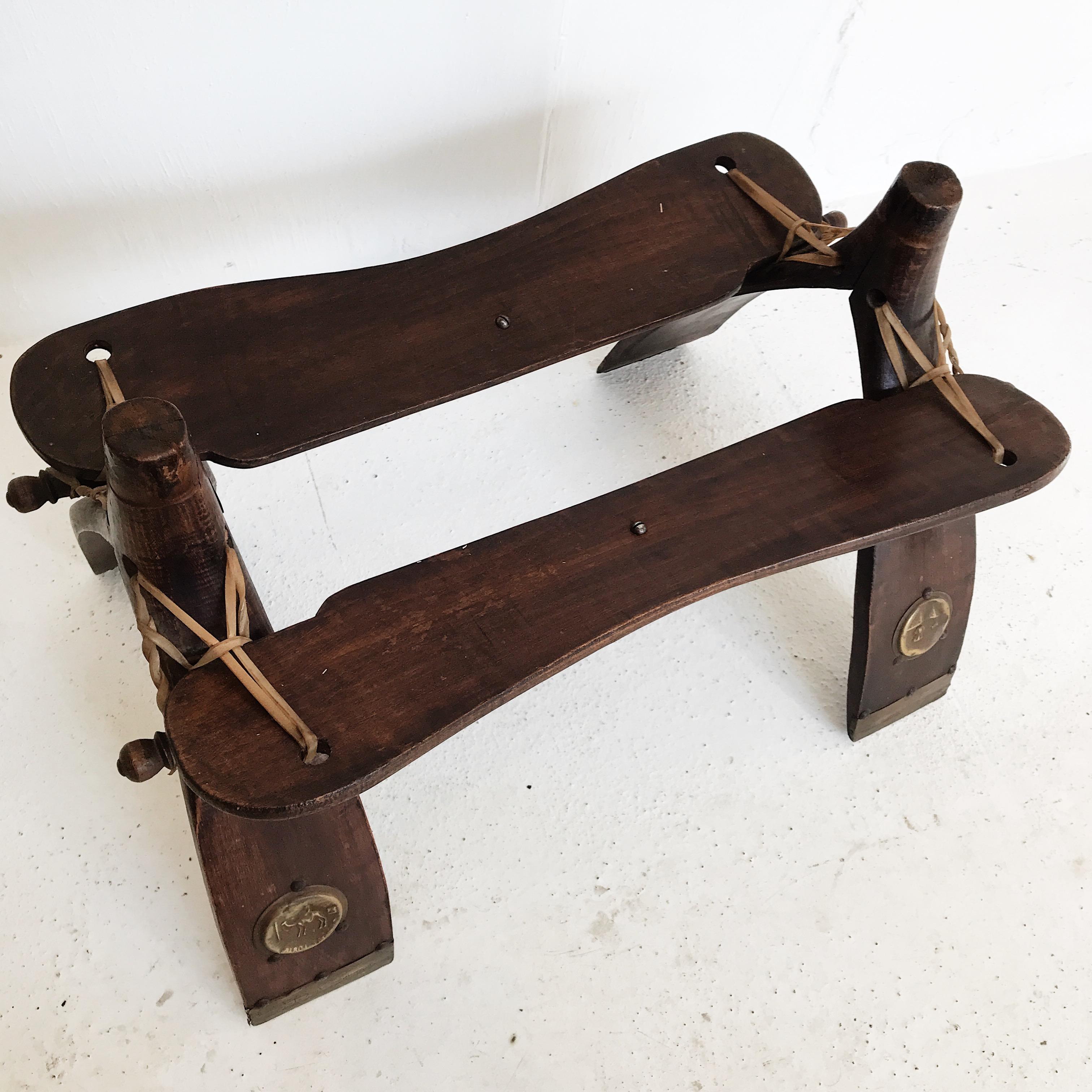 Mid-20th Century Egyptian Wooden Camel Saddle Stool with Original Leather Saddle In Fair Condition For Sale In Ettalong Beach, NSW