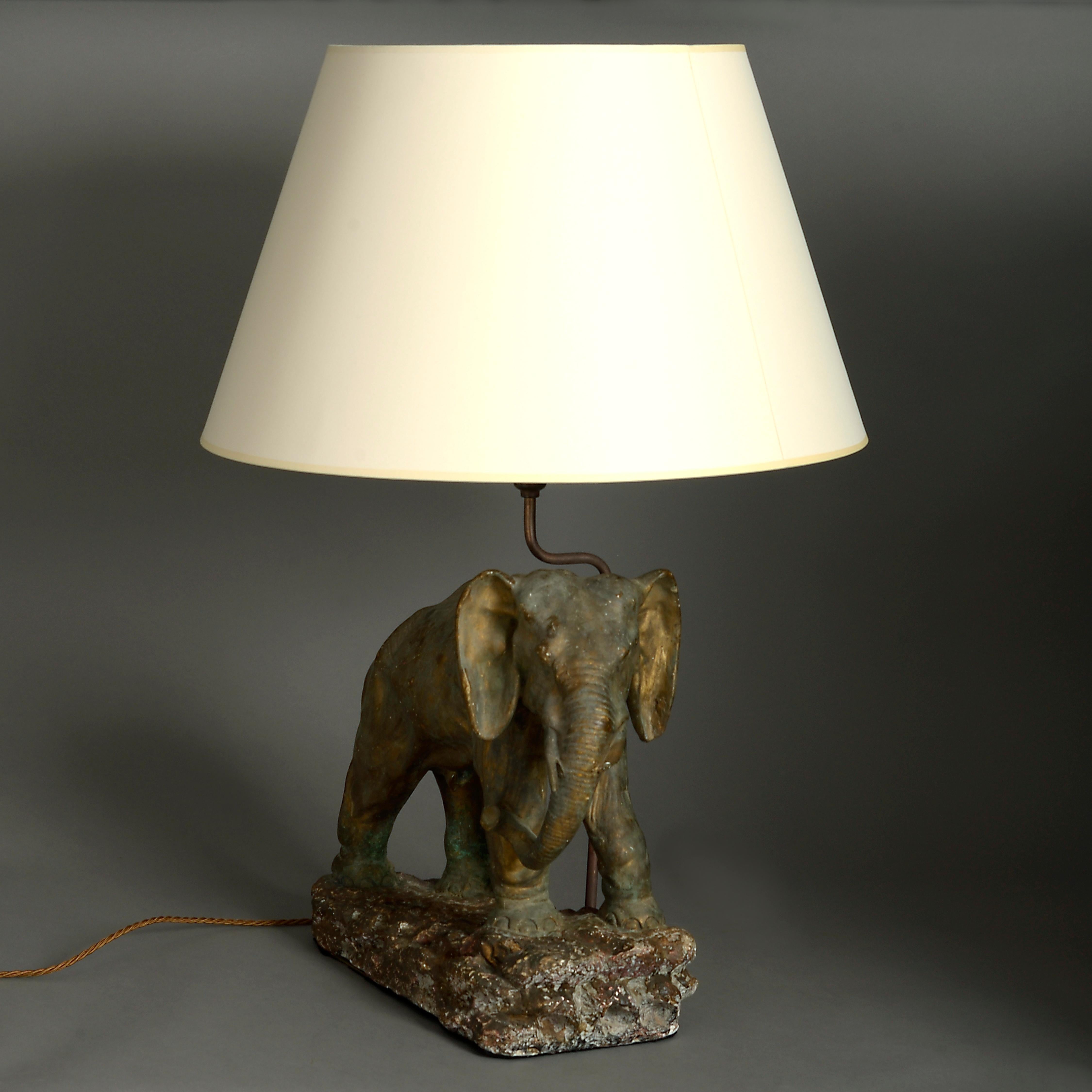 A mid-20th century cold painted elephant sculpture lamp base.

Dimensions refer only to elephant and base.

Shades available to purchase separately.