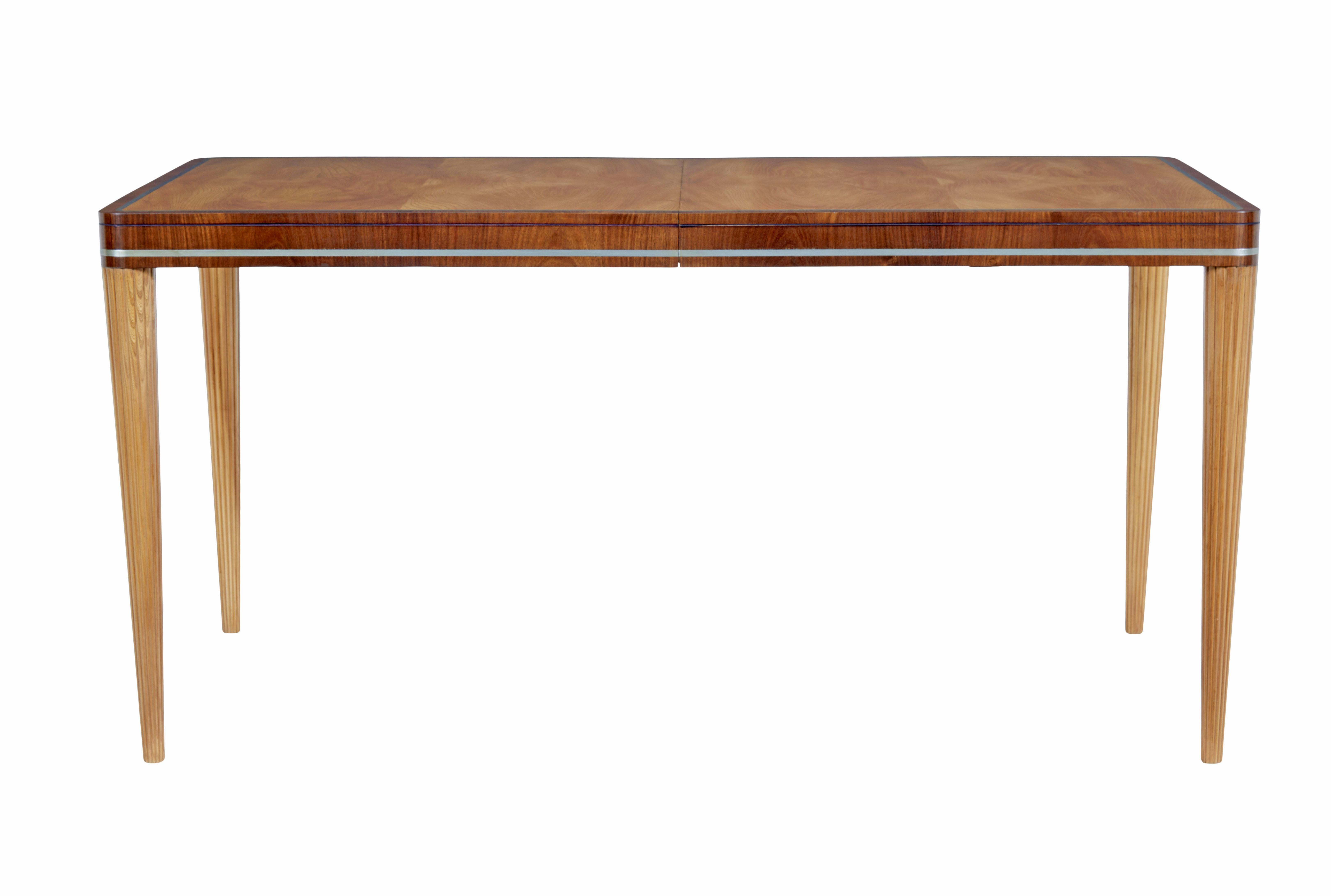 Mid 20th century elm and mahogany table by Carl Bergsten circa 1930.

Beautiful table by well respected Swedish designer carl bergsten (1879-1935)

This table is able to extend, but is currently fixed closed, there is no leaf.  This lends itself