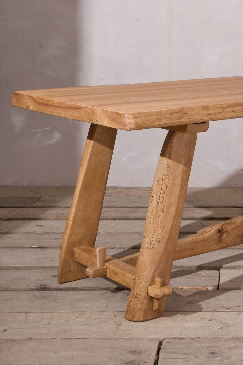 This is a very smart 20th century waney edged dining table made from elm. Wonderful figuring to the wood and naturalistic elements that make this hugely decorative. Finished in a clear oil to help protect the wood from everyday life
Height 74cm