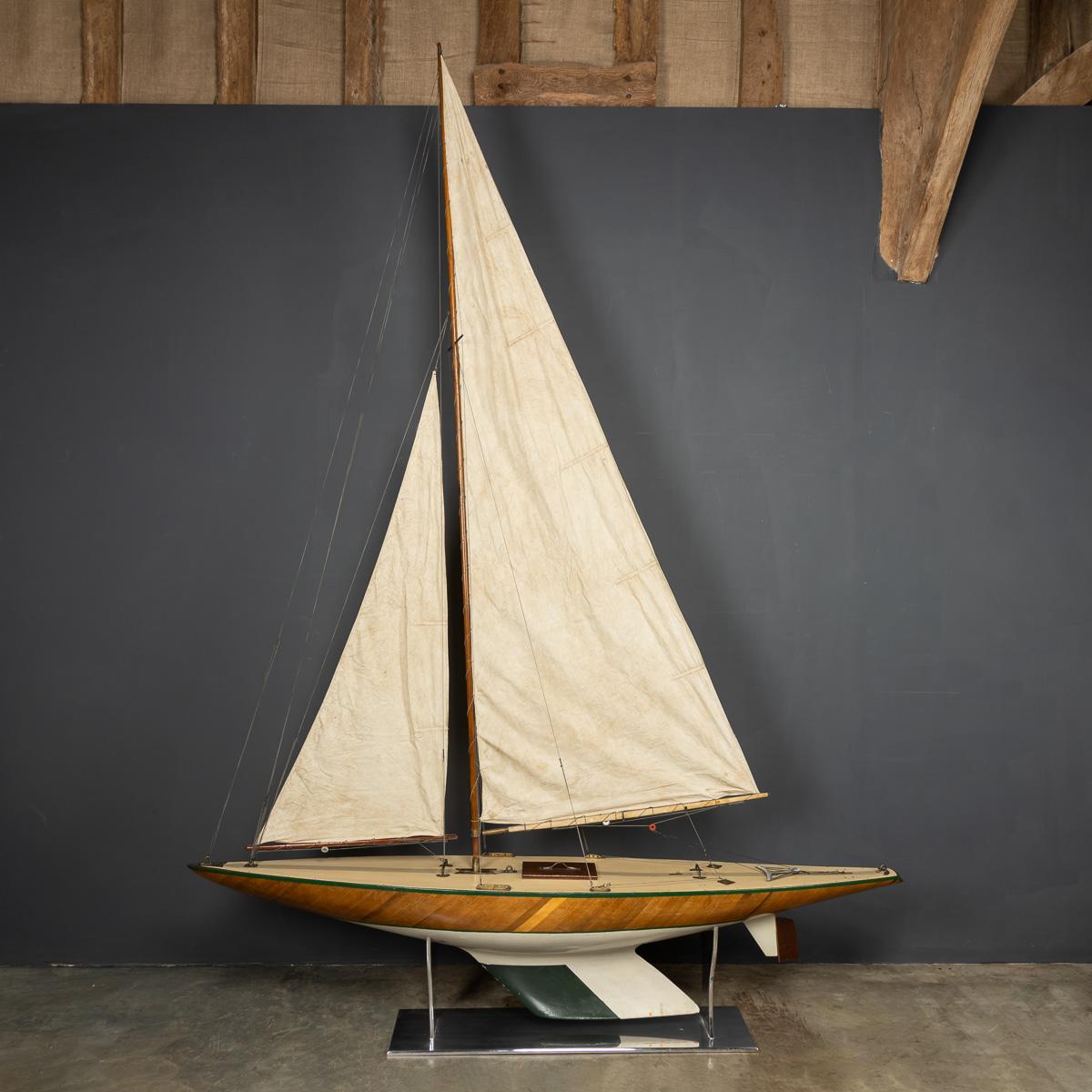 Mid-20th Century bermudan sloop pond yacht, with a lovely carved two tone hull. The yacht is a great example of British pond racing yacht and would have raced against similar yachts in competitions, club against club, all over Britain, sometimes