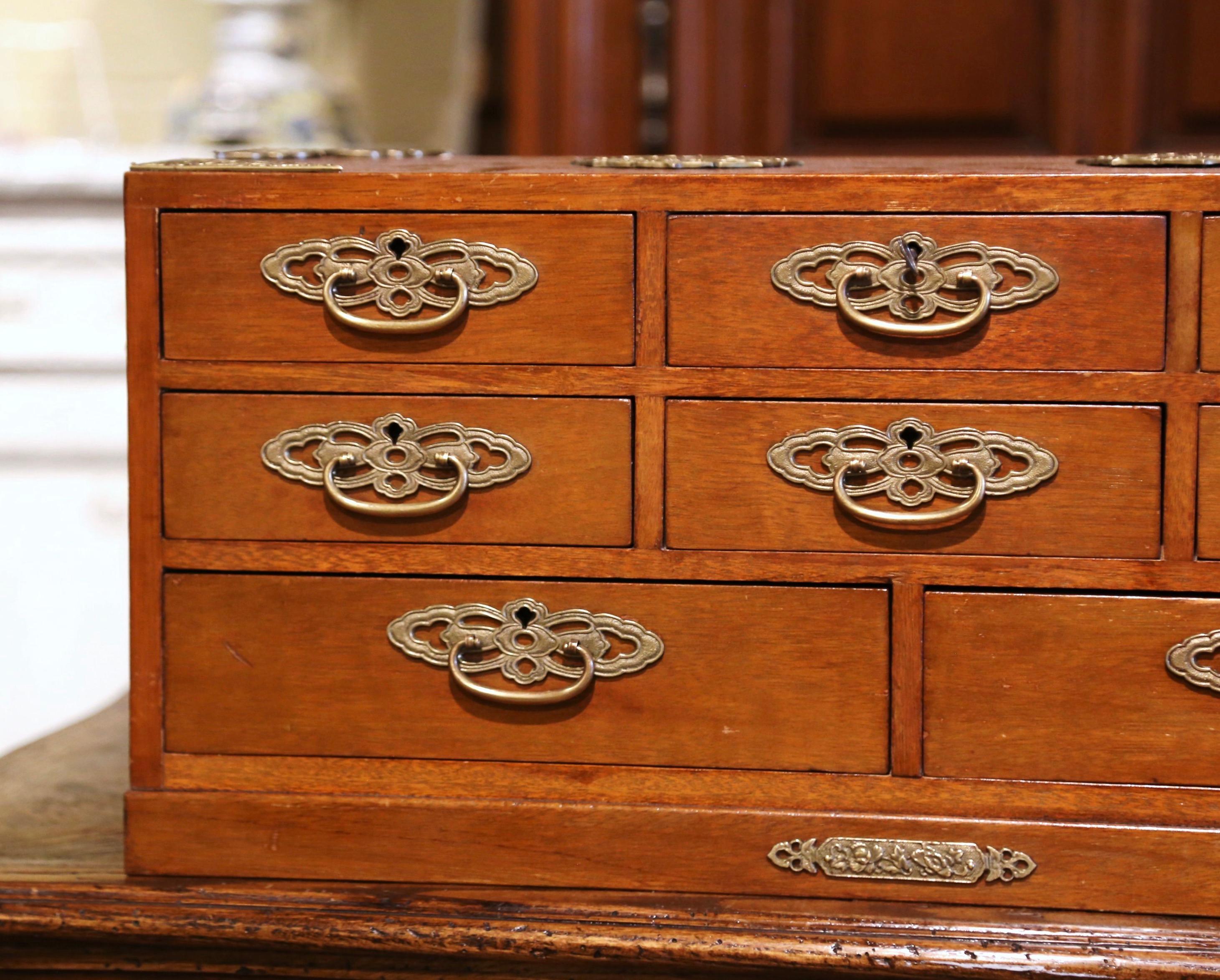 Hand-Crafted Mid-20th Century English Carved Mahogany and Brass Eight-Drawer Jewelry Box