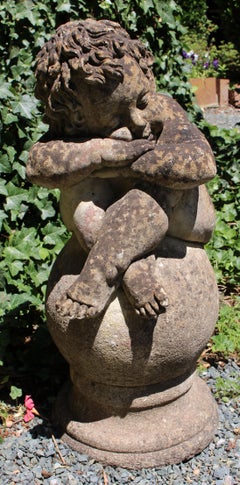 Mid-20th Century English Cast Stone Figure of a Sleeping Boy on a Ball