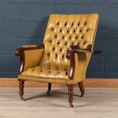 Mid 20th Century English Leather Reading Chair with a Metamorphic Armrest