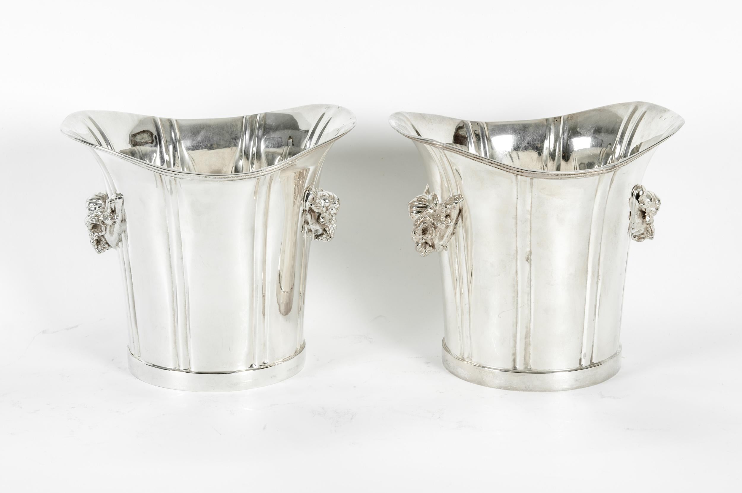 Mid-20th century English pair silver plated ice bucket / wine cooler with exterior design details. Each one is in great vintage condition. Minor wear consistent with age / use. Each ice bucket is about 7.9 inches high x 9 inches top diameter.