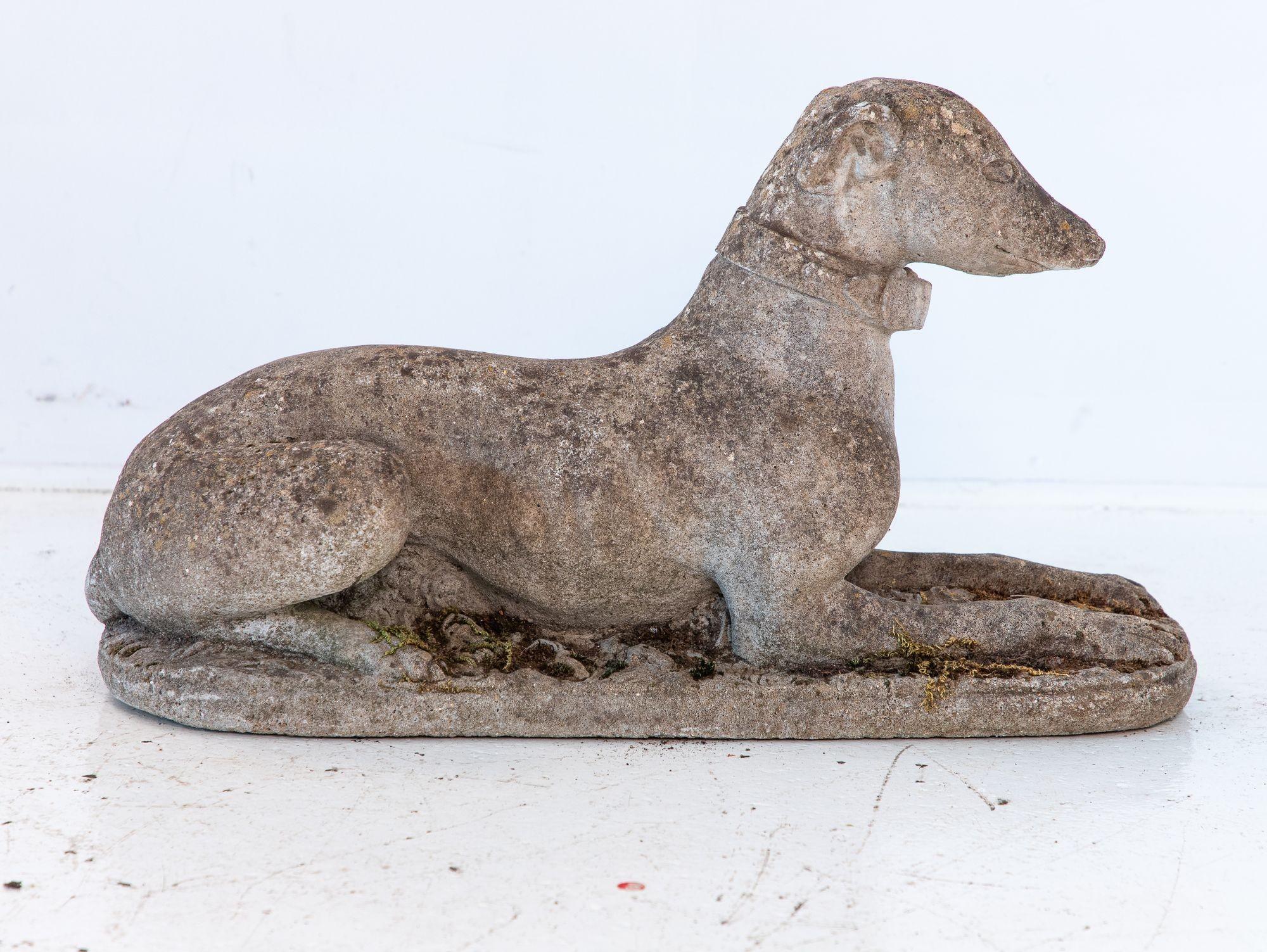Crafted in the mid-20th century from durable concrete, this elegant whippet, or greyhound, statue features elongated limbs, an alert expression, and a natural patina from years outdoors. Its neutral tones and timeless form make it an ideal addition