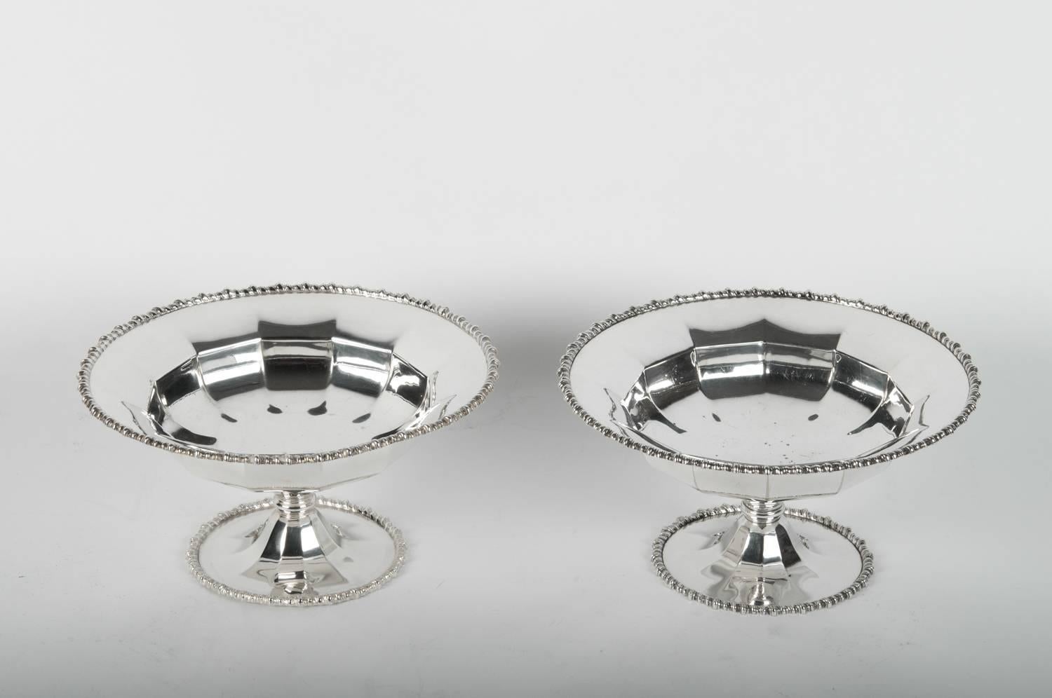 Mid-20th century English silver plated pair of dessert serving pieces / compote. Each one is in great vintage condition, maker's mark undersigned. Minor wear consistent with age / use. Each one stands about 8.5 inches diameter x 4.5 inches high.