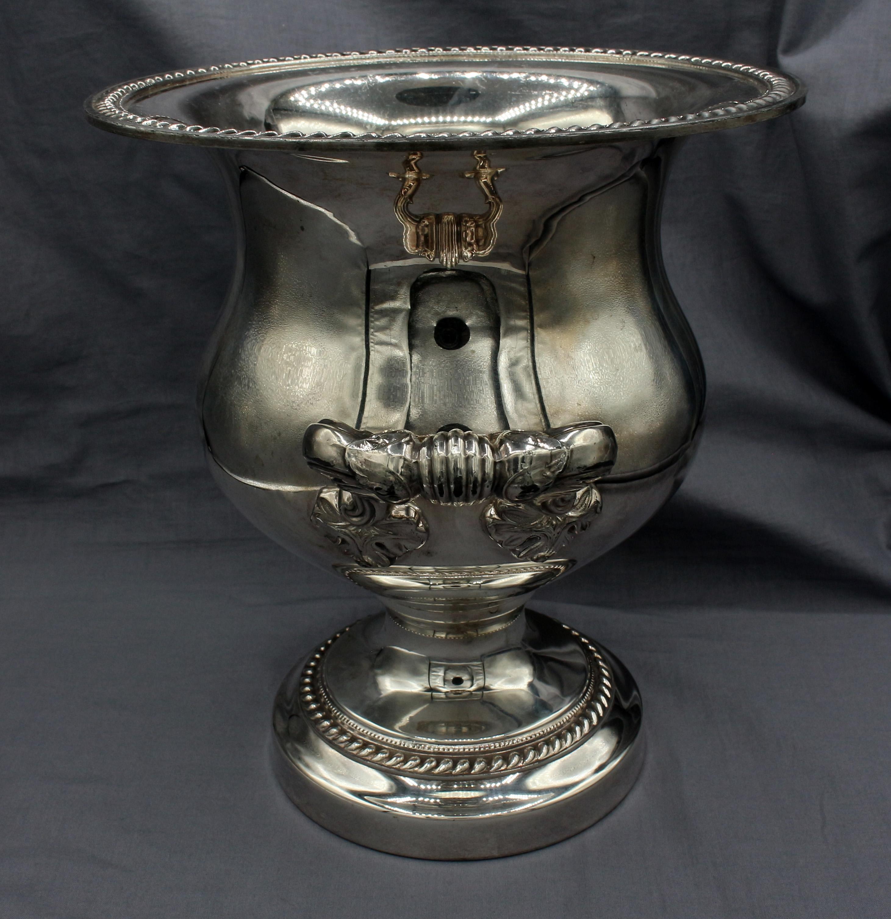 Mid-20th century English silver plated champagne cooler. Classical design with bold acanthus motif handles & repetitive motif borders. Provenance: Councill family of furniture making in N.C.
11