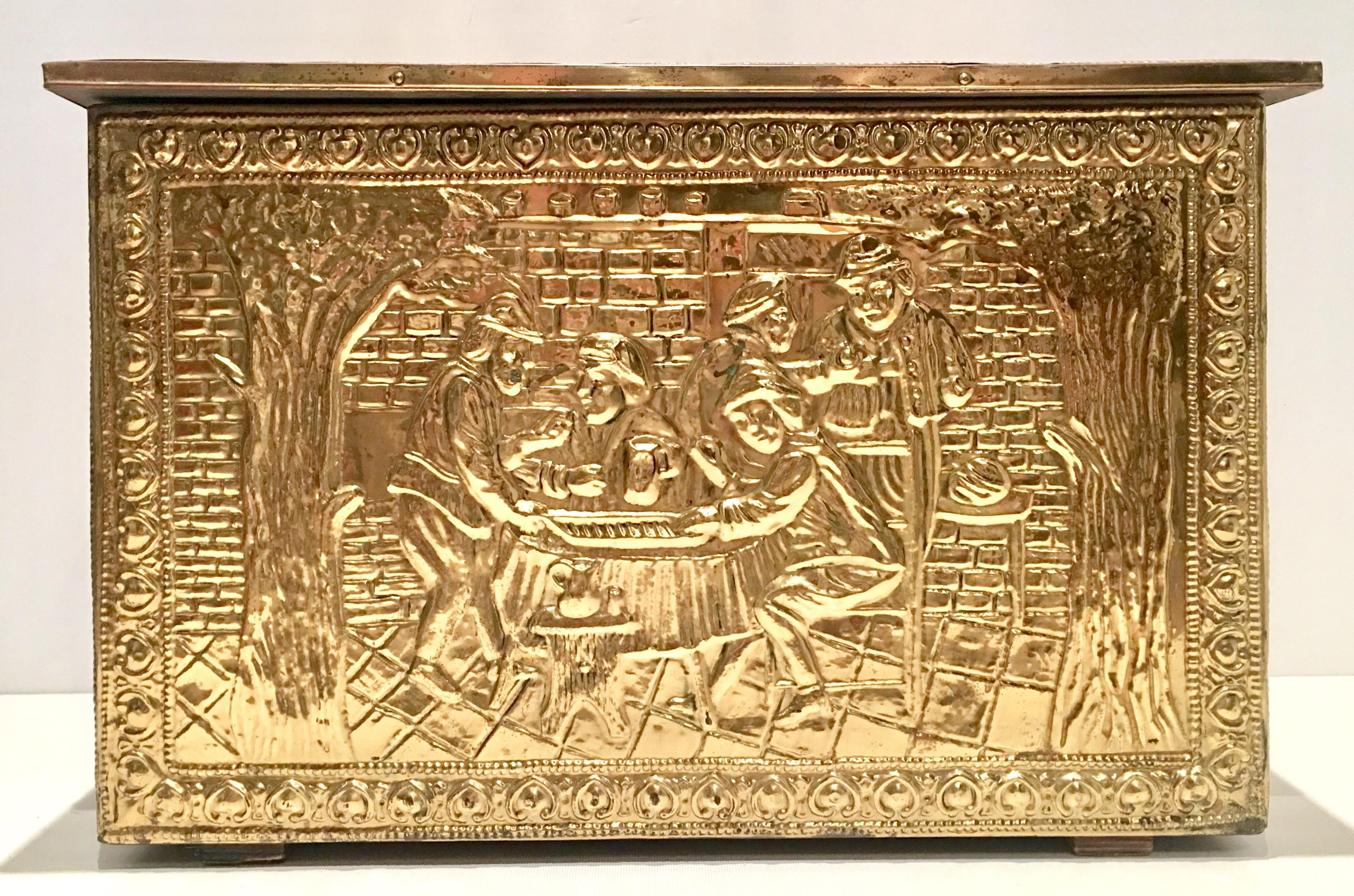 Mid-20th century English brass repousse and wood hinged storage box. Features a wood base with hammered brass panels and wood feet. The box depicts different English country tavern scenes at the top, front and both sides.
Signed on the back steel