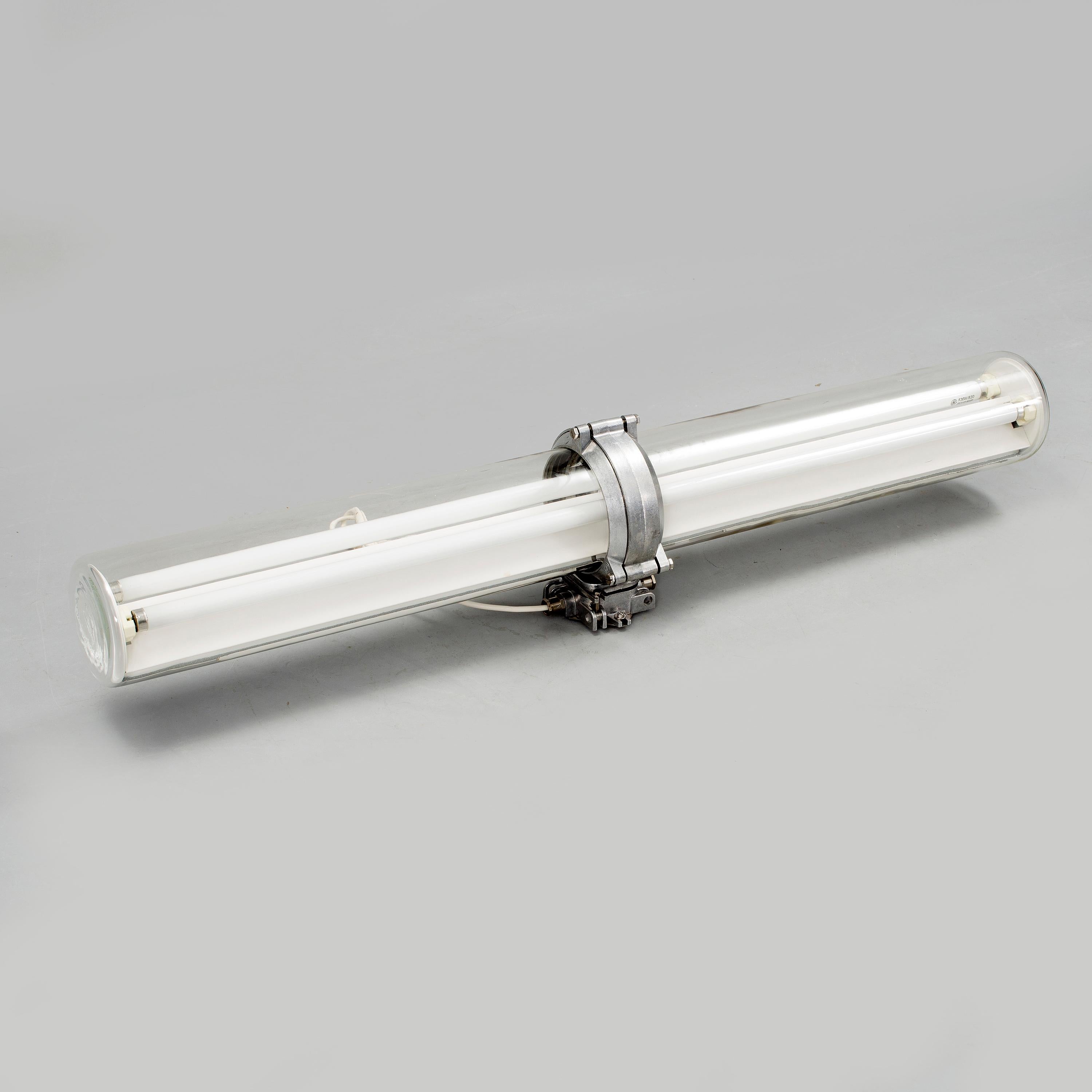 Exaktor neon tube Industrial lighting, produced in mid-20th century. Cylinder-shaped glass casing to aluminium mounts. Model to be mounted on celling or wall.