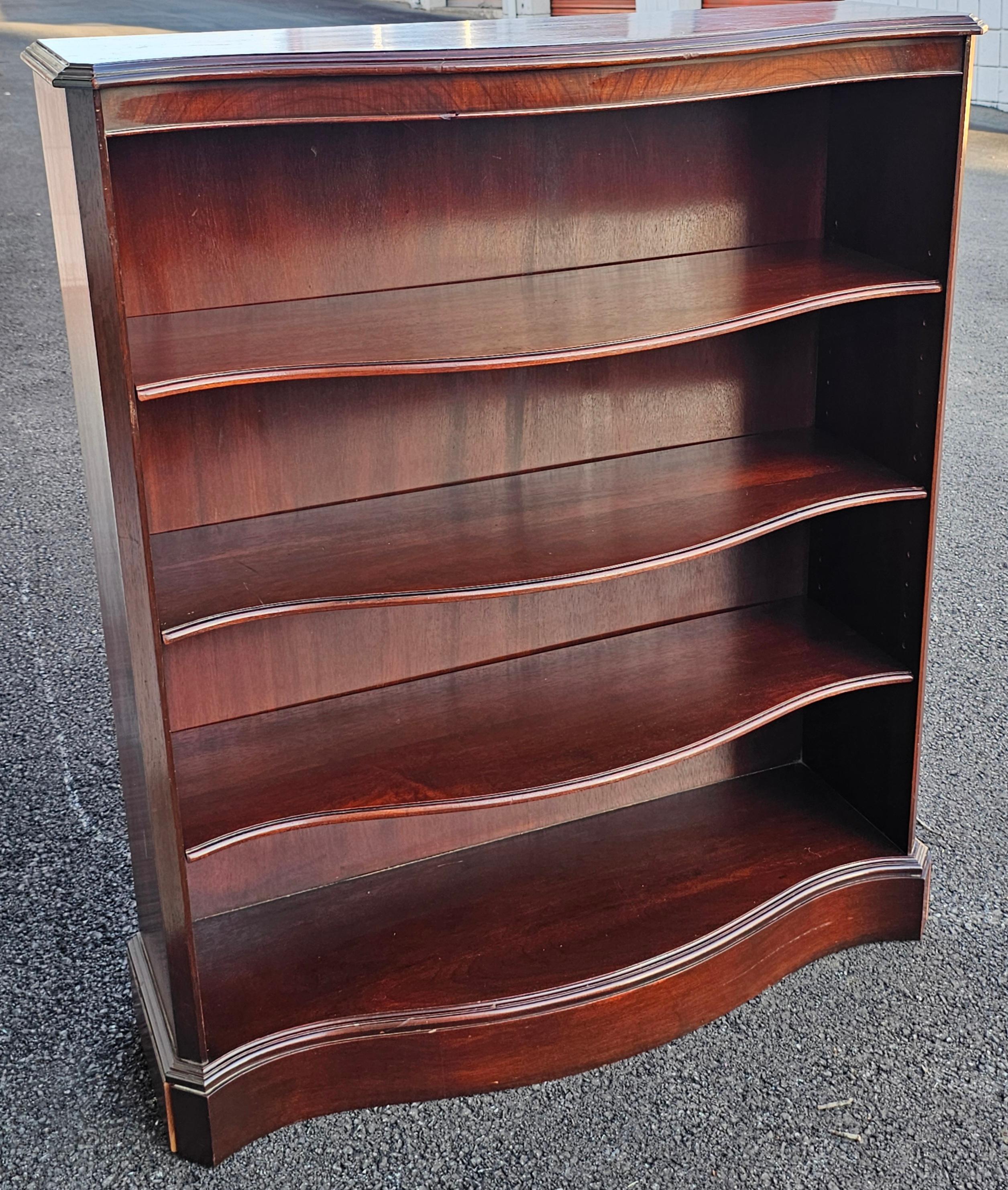 A Mid-20th Century Federal Style Solid Mahogany Medium Size Serpentine Bookcase. Comes with 3 adjustable shelves, all mahogany.
Measures 35.25