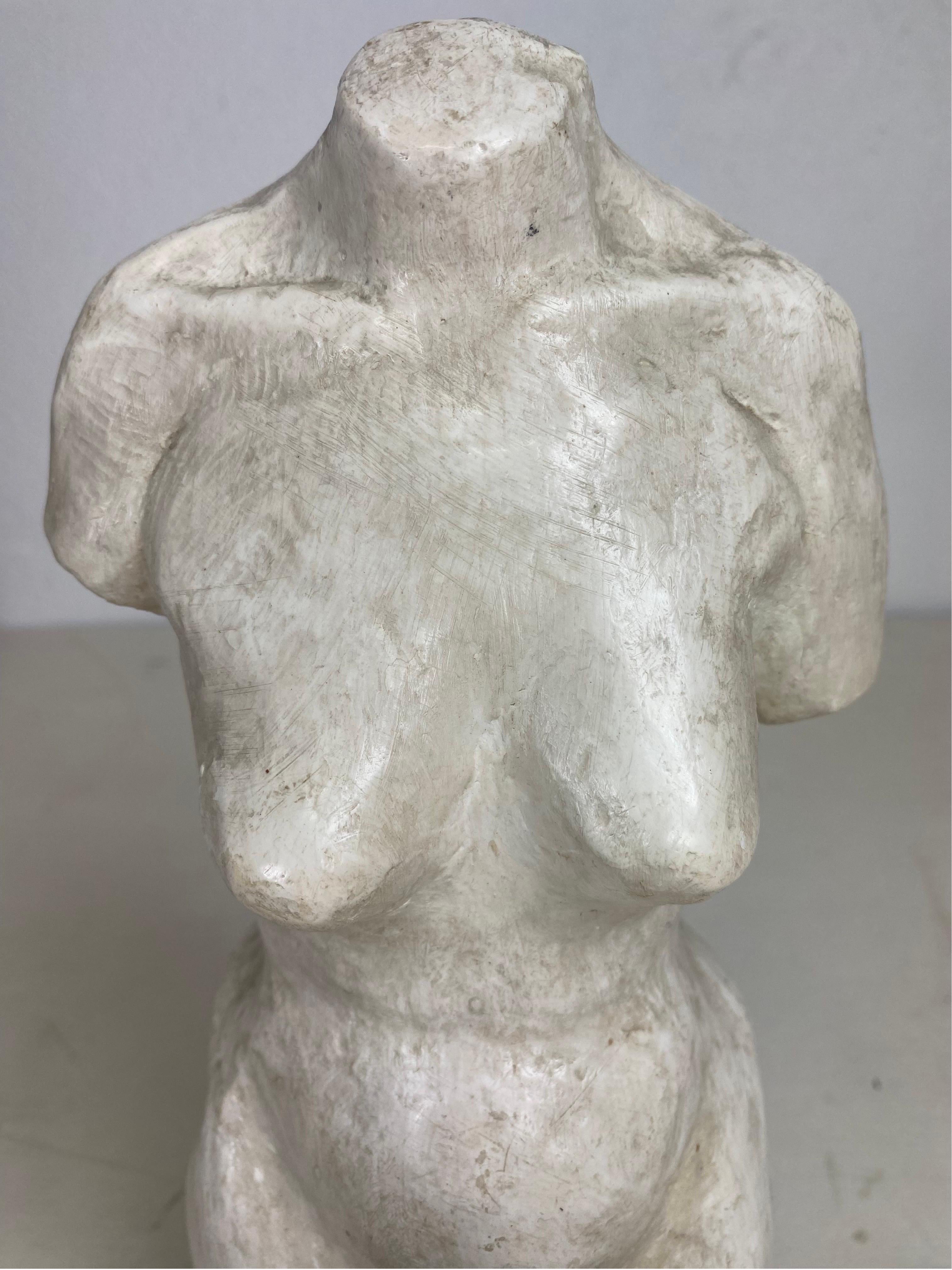 This is a mid century female nude study in plaster. This plaster sculpture stands on a dark walnut vase. The sculpture has a venetian plaster style finish to the surface of the sculpture. This is American made circa 1960.