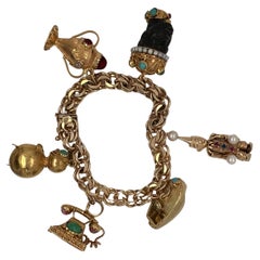 Retro Mid-20th Century Figural Yellow Gold and Gemstone Charm Bracelet