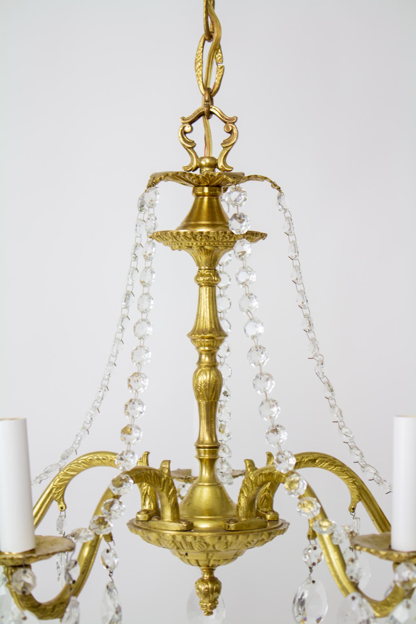 Hollywood Regency Mid-20th Century Five Arm Spanish Cast Brass and Crystal Chandelier For Sale