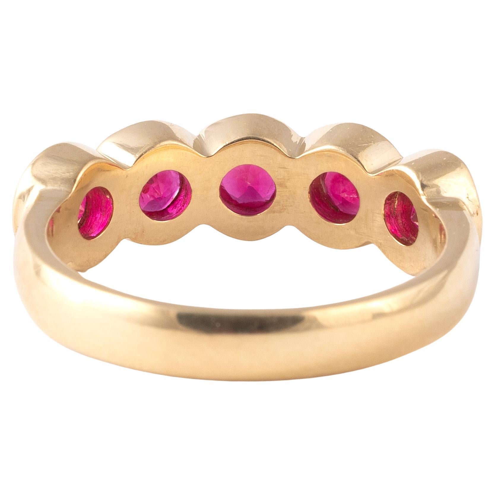 Mid-20th century five stone Burma ruby ring, with graduated round cut ruby, approximately 1.3cts in all, claw set in 18kt yellow gold.
Size: 7 1/4
Weight: 5.88gr.

