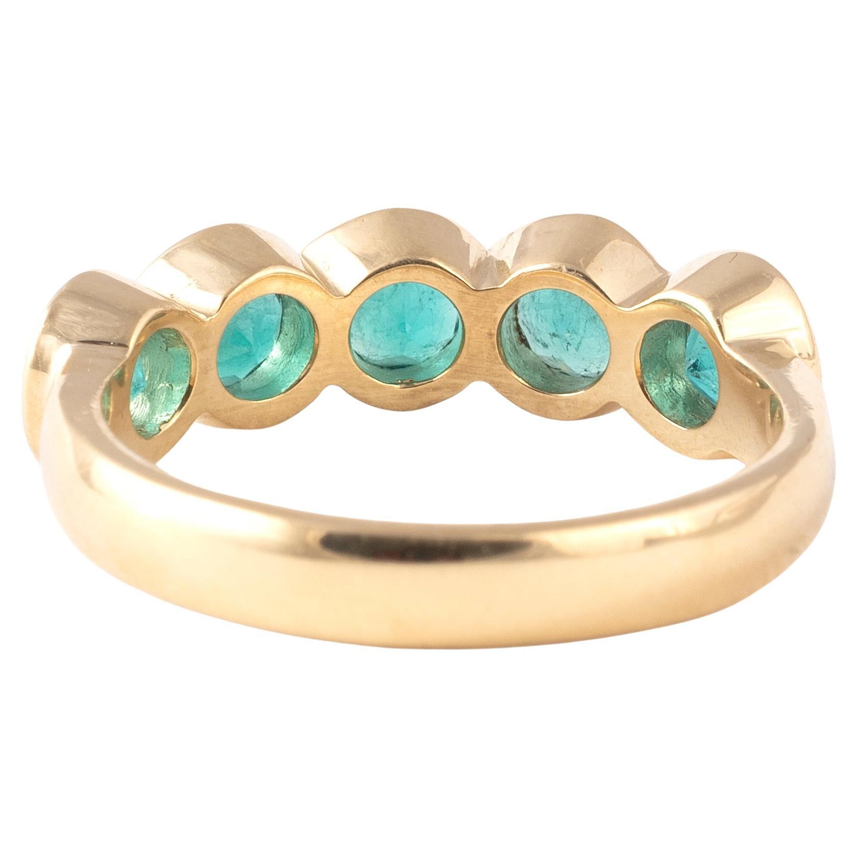 Mid-20th century five stone Colombian emerald ring, with graduated round cut emerald, approximately 2cts in all, claw set in 18kt yellow gold.
Size: 7 1/4
Weight: 5.52gr.

