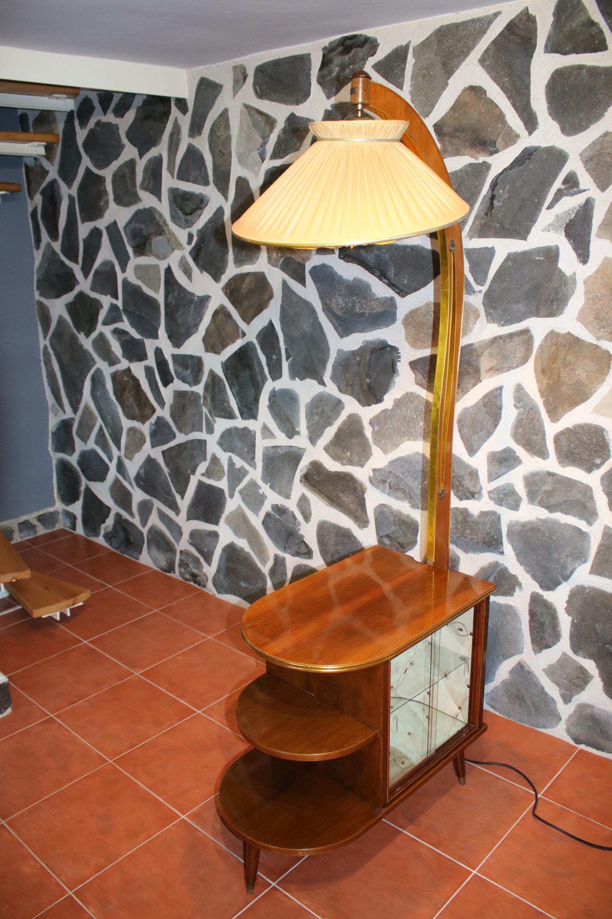 A beautiful Czech mid 20th century lamp features a built-inliquor cabinet, which is beautifully lighted with an integrated light bulb. The liquor cabinet features a beautiful original upholstery.