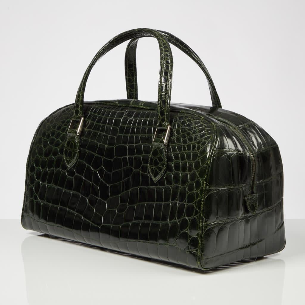 Introducing a stunning 20th Century Forest Green Crocodile Luggage Holdall—a fabulous and generously sized bag in unused condition.

This holdall is meticulously crafted from premium center skins that beautifully retain their original patina,