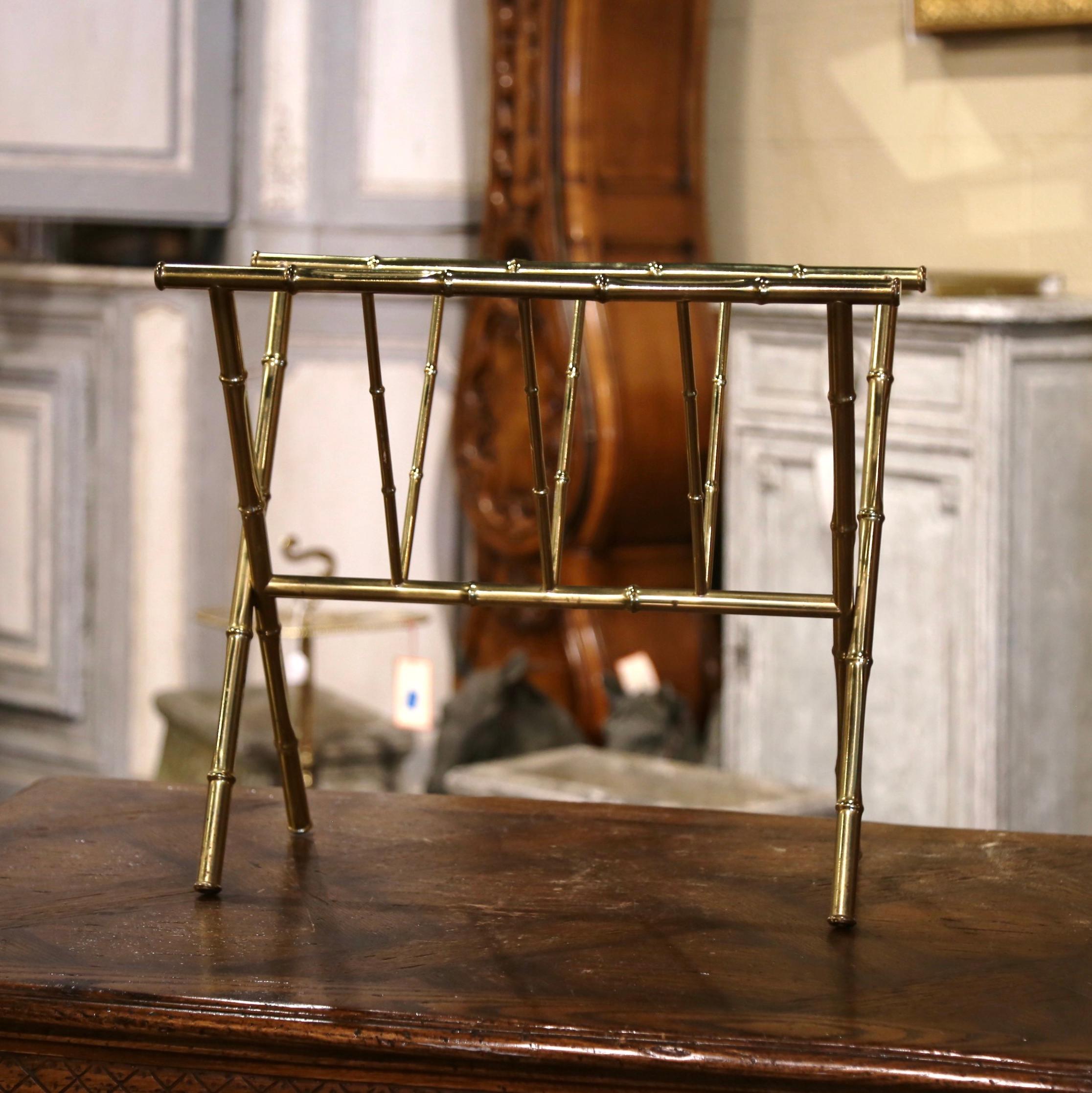 Keep your newspapers organized and neat inside this vintage magazine holder. Crafted in Paris France circa 1950, and attributed to Maison Bagues, the elegant, mid-century brass stand is both useful and stylish. The rack has a popular faux bamboo