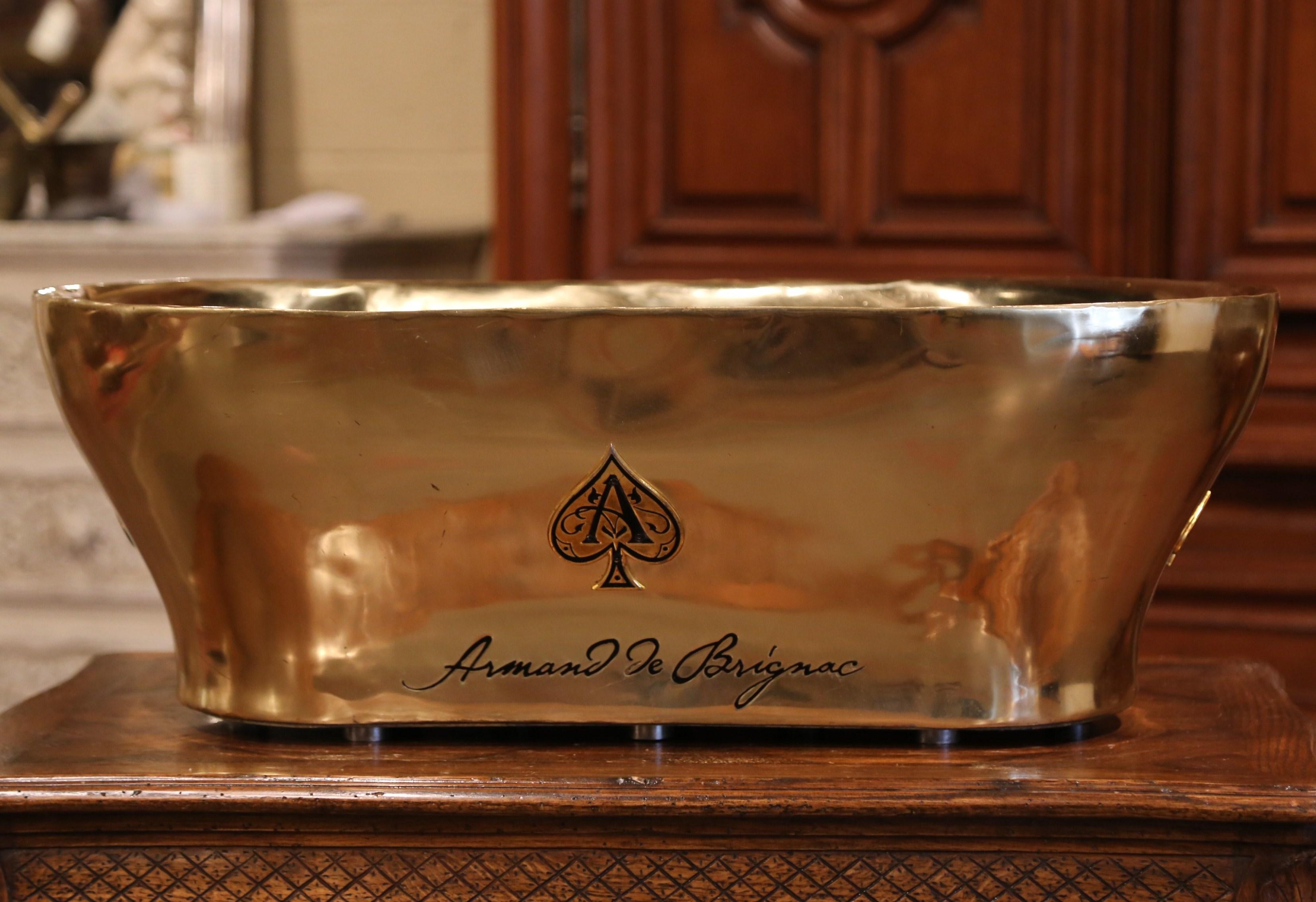 The important champagne cooler was created in France circa 1950; signed Armand de Brignac on both sides, the heavy brass tub would make a wonderful cooler for beer, wine or any drink needed to stay cold. The large tub is in excellent condition with