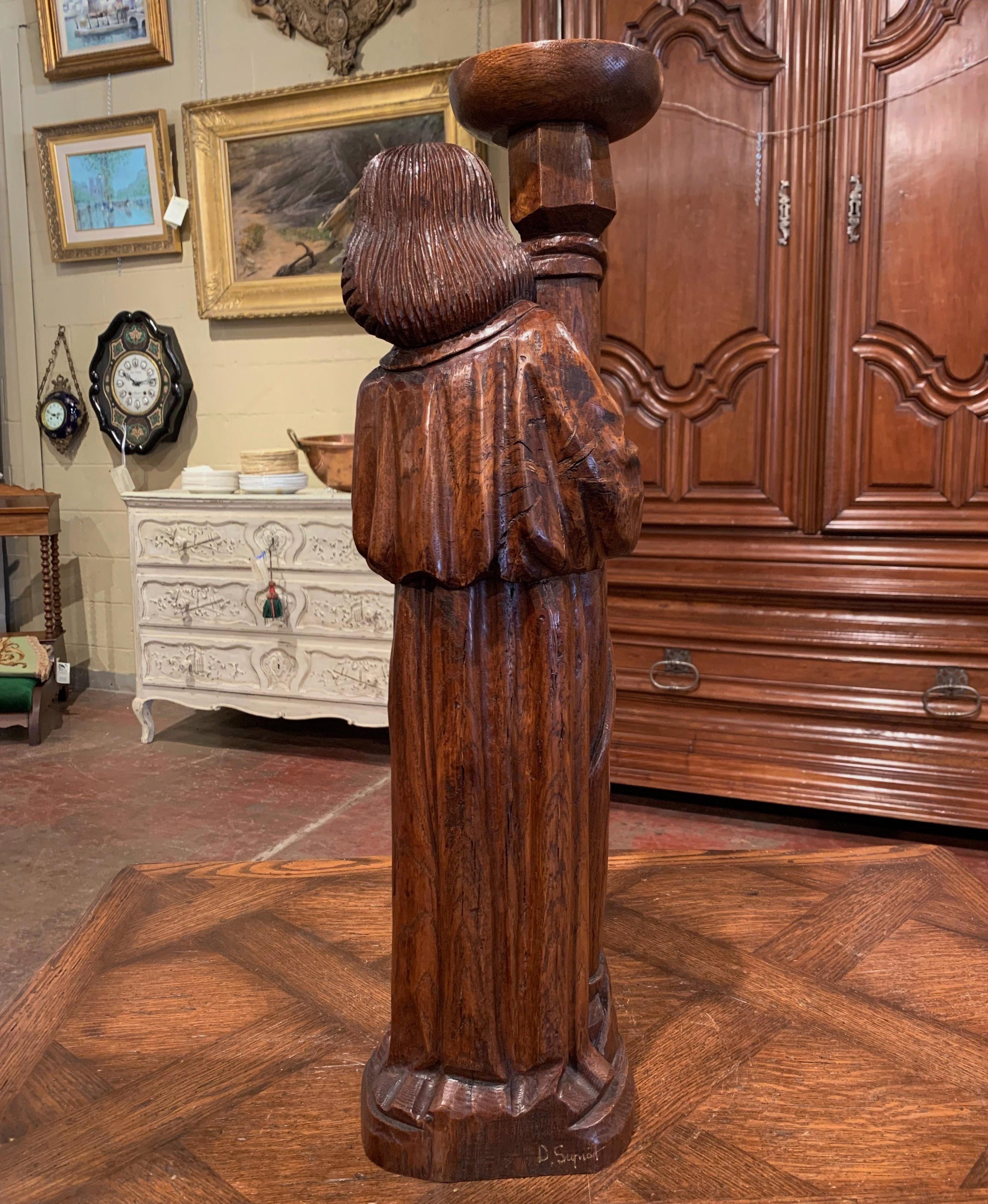 Patinated Mid-20th Century French Carved Oak Statuary Candleholder For Sale