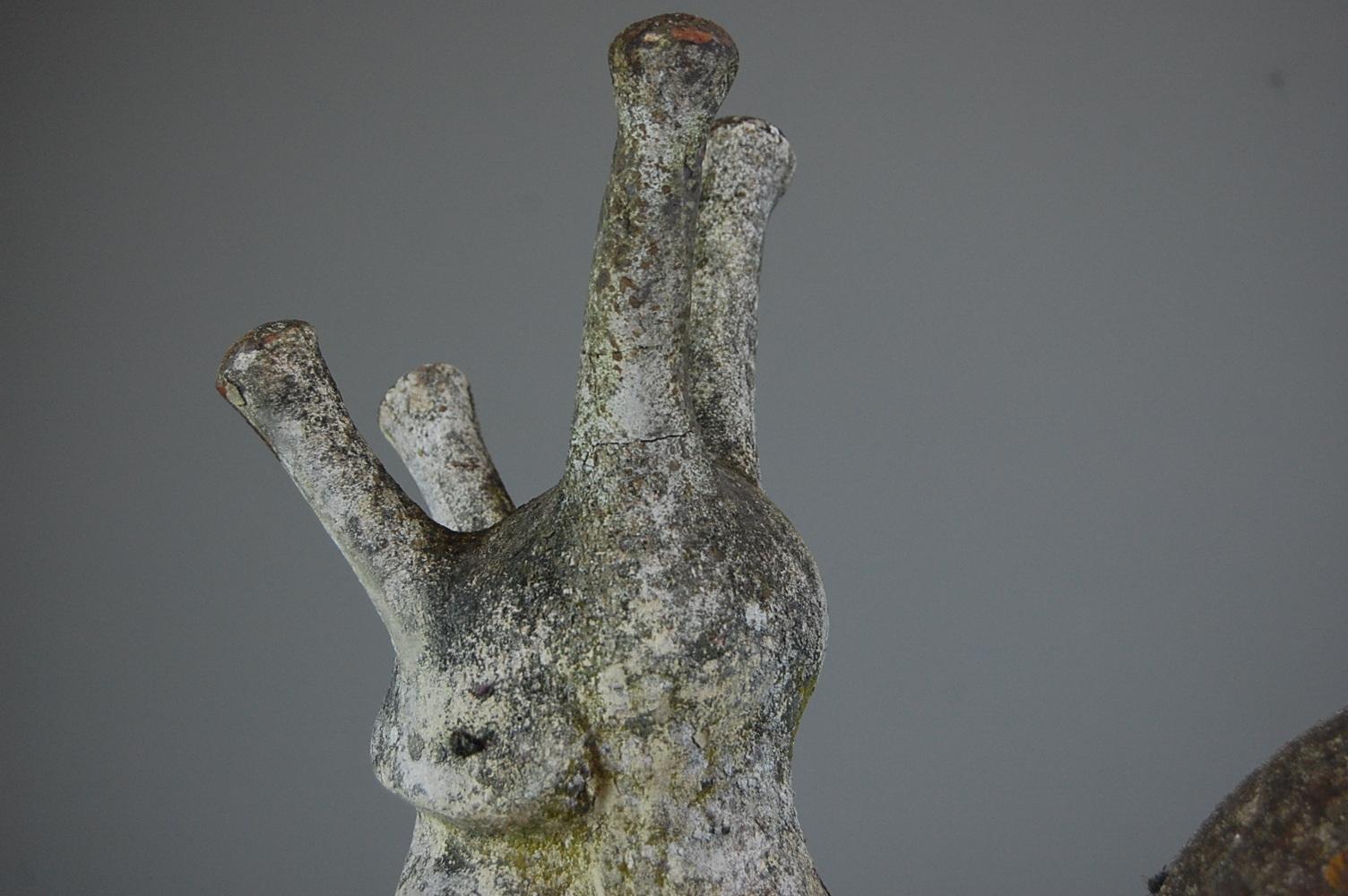 Wonderfully weathered original cast stone snail in the original weathered paint. Burgundy France, circa 1950.