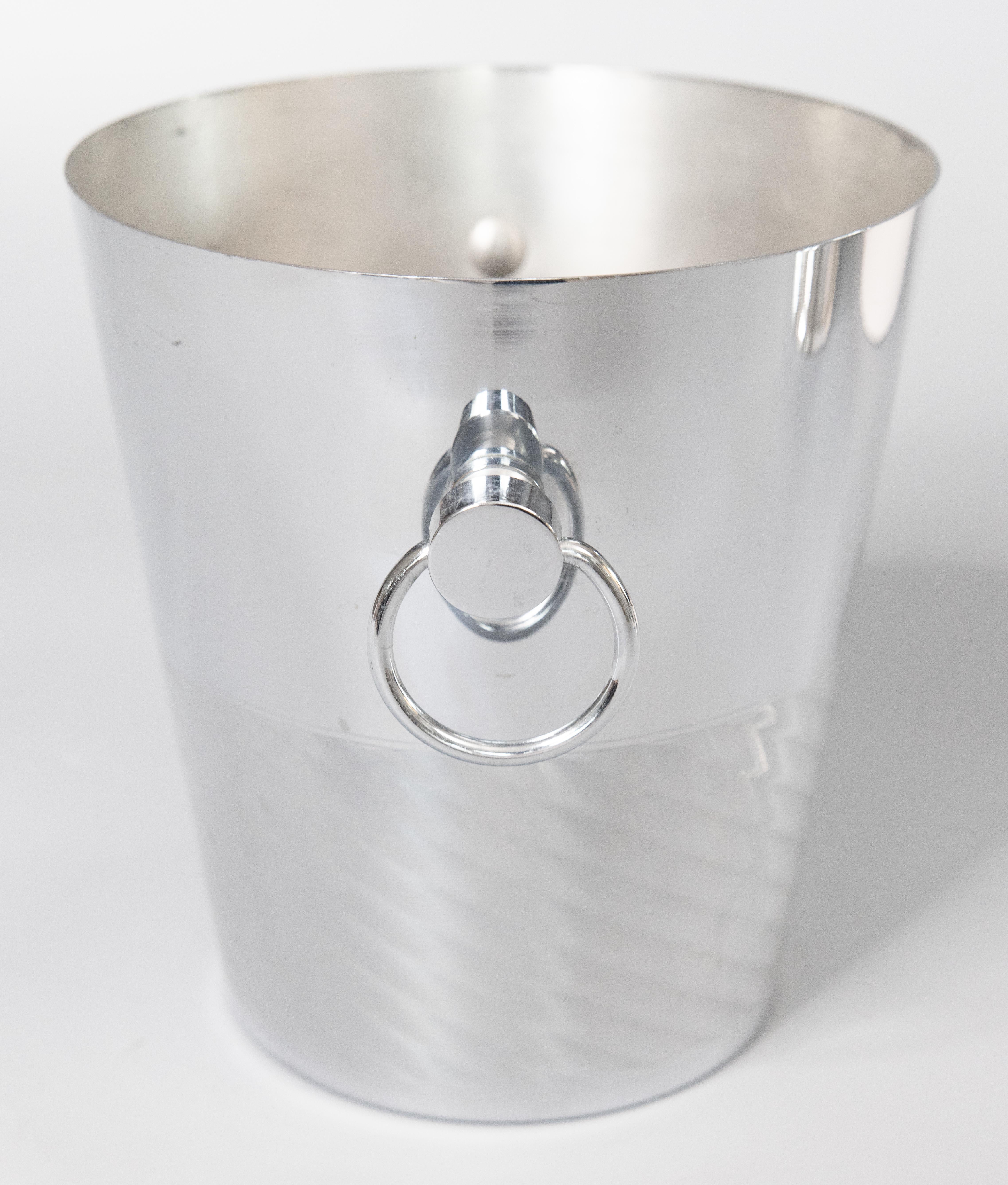 A fabulous Mid-20th Century French chrome plated champagne bucket or wine cooler, made by André Leroy in France, circa 1960. Maker's mark on reverse. This stylish ice bucket is well made and heavy with a sleek design, perfect for the modern
