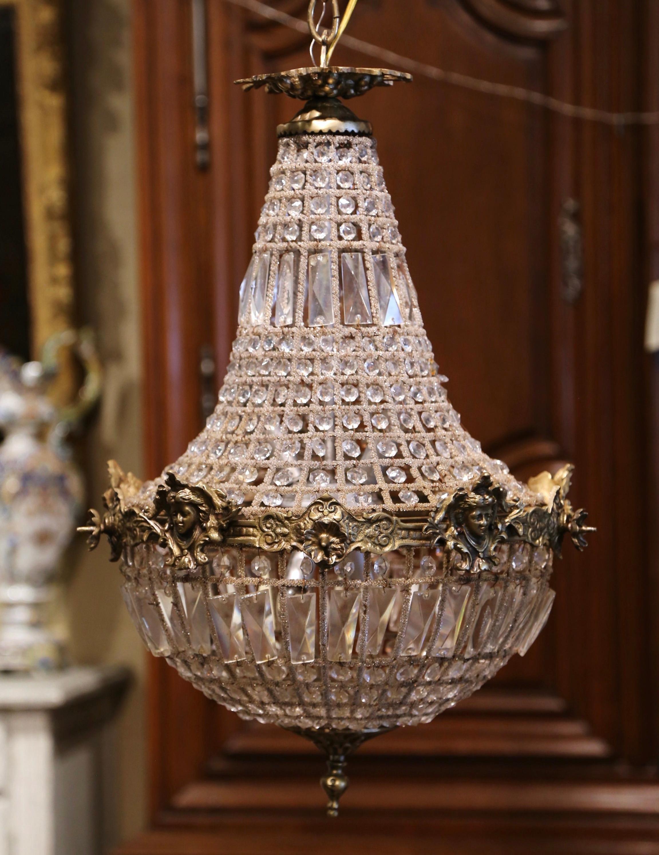 Brighten your hallway with this vintage Louis XVI bronze and crystal light fixture; crafted in France, circa 1950, and round in shape, the basket chandelier features four inside lights newly wired. The ceiling fixtures have cut crystal all around,