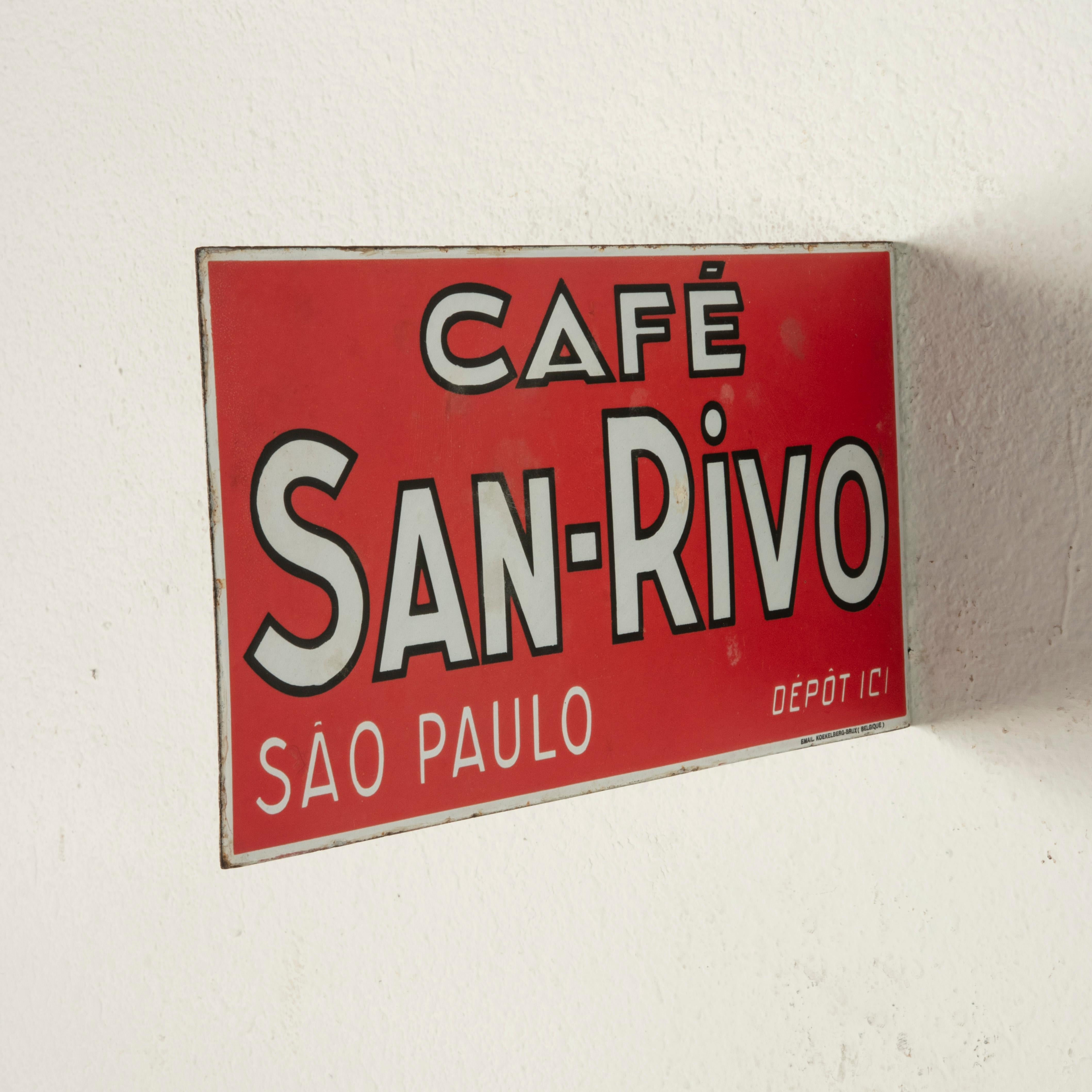 This mid-twentieth century red and white enameled metal sign is double faced and promotes the Cafe San Rivo in Sao Paolo, Brazil. Below is marked Depot Ici indicating that the cafe was also a drop-off location for packages. On one side in small